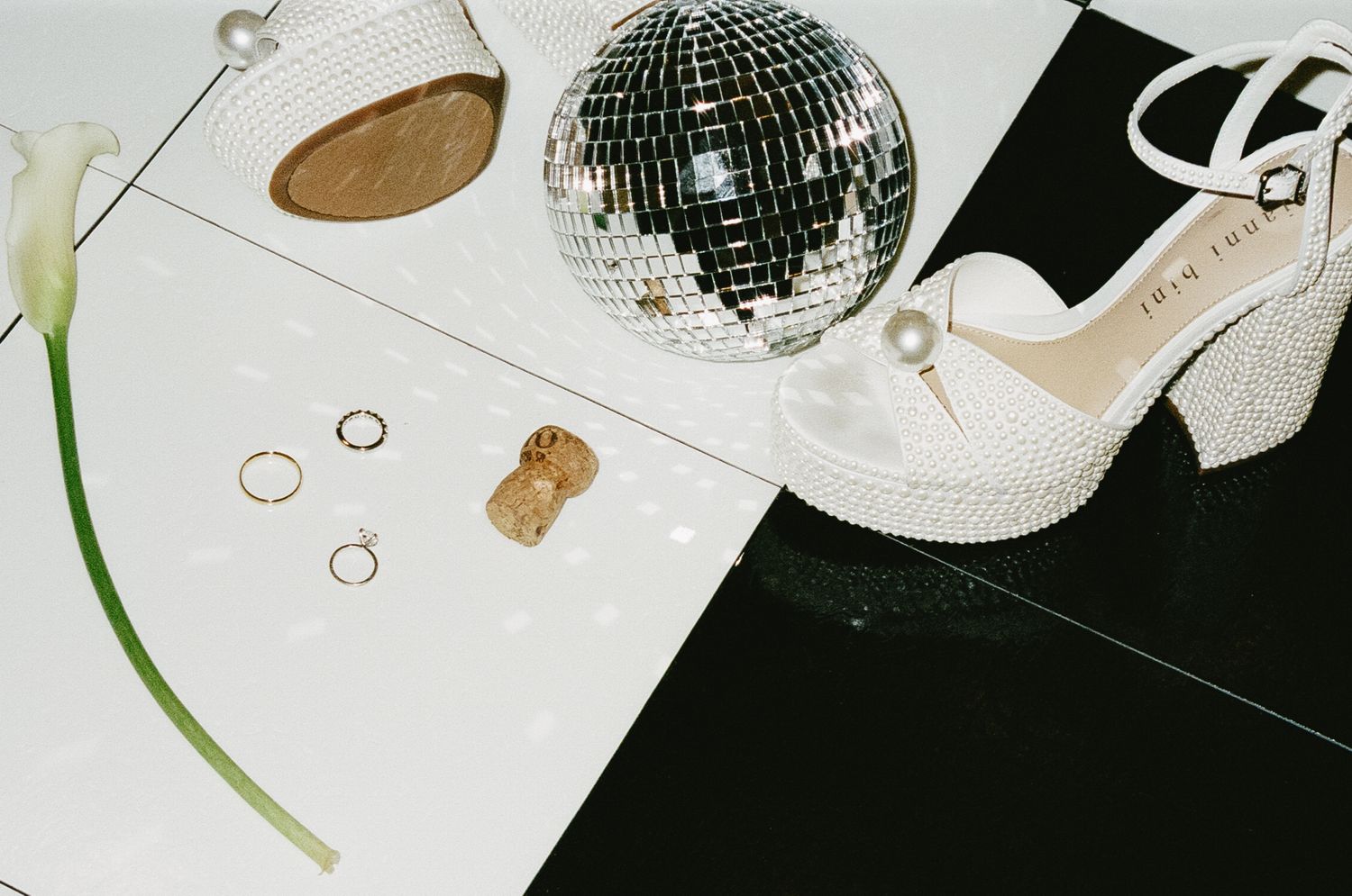 Modern wedding decor featuring disco balls and minimalist design elements.