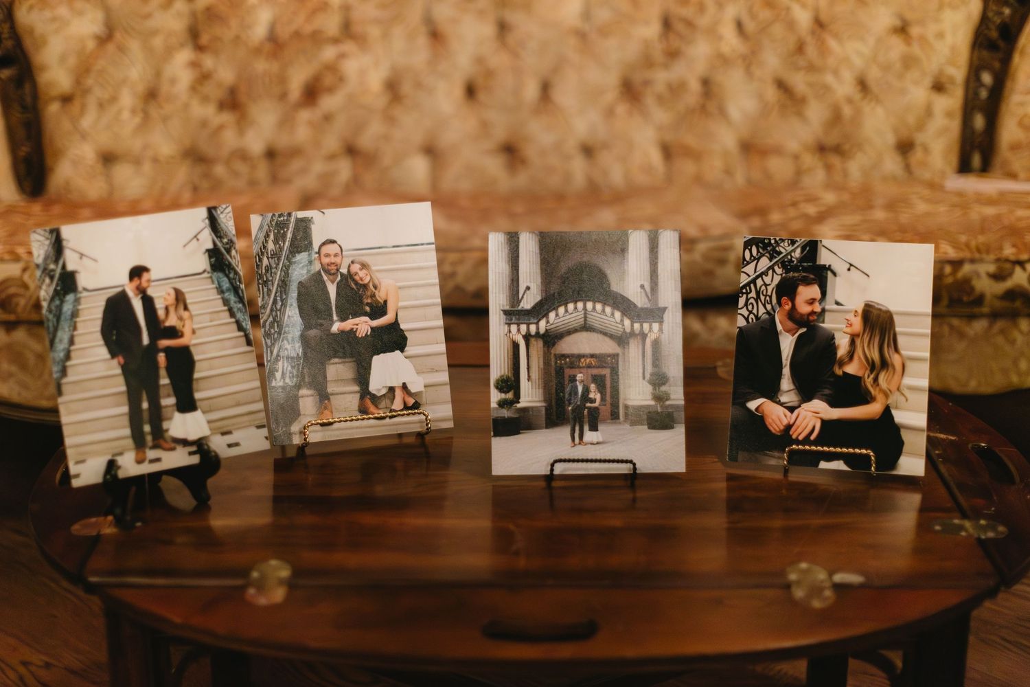 Vintage photographs displayed in frames along a wooden wall in warm lighting.