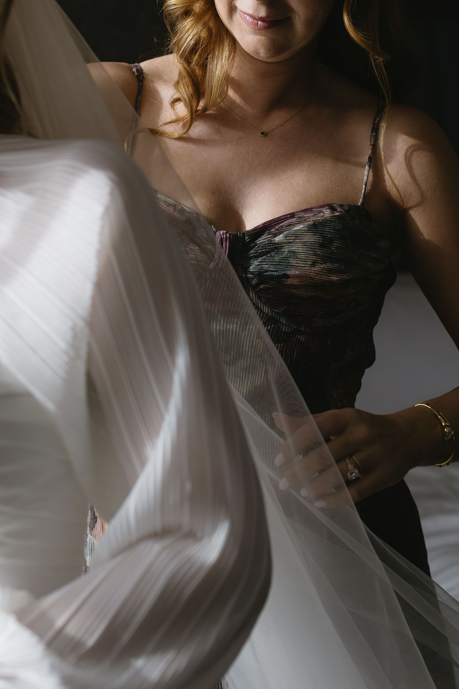 Artistic black and white motion shots of flowing wedding dress fabric.