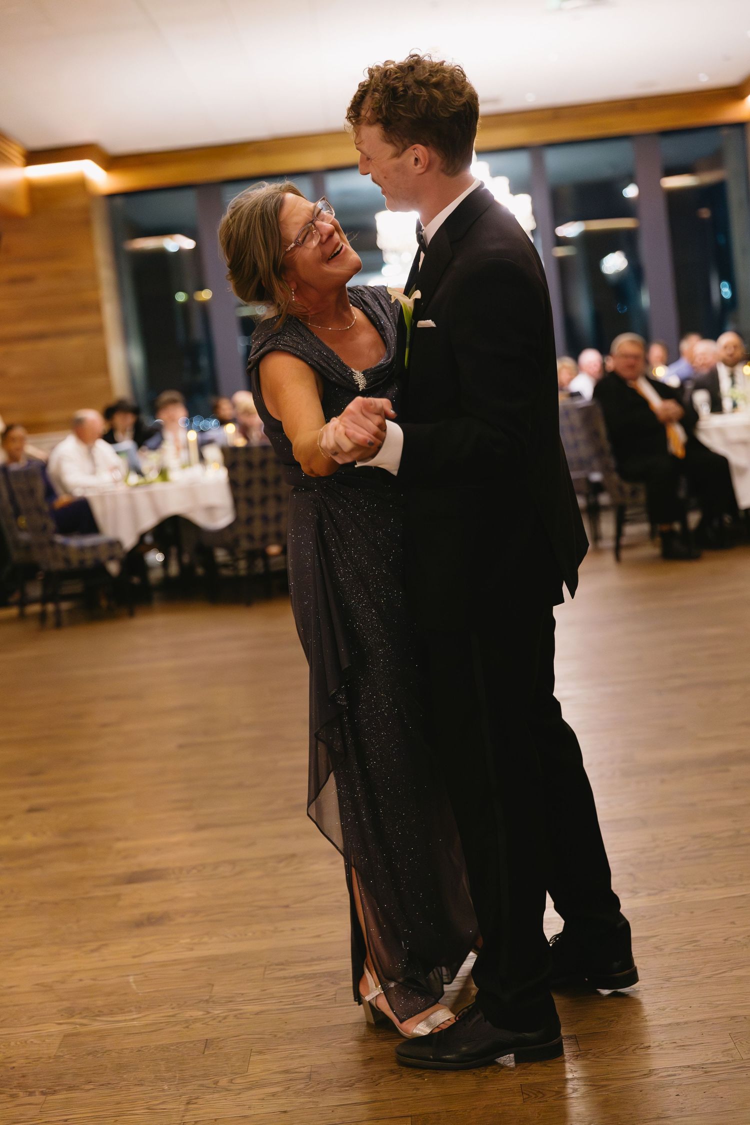 Dancing couple shares an intimate moment on the reception dance floor.