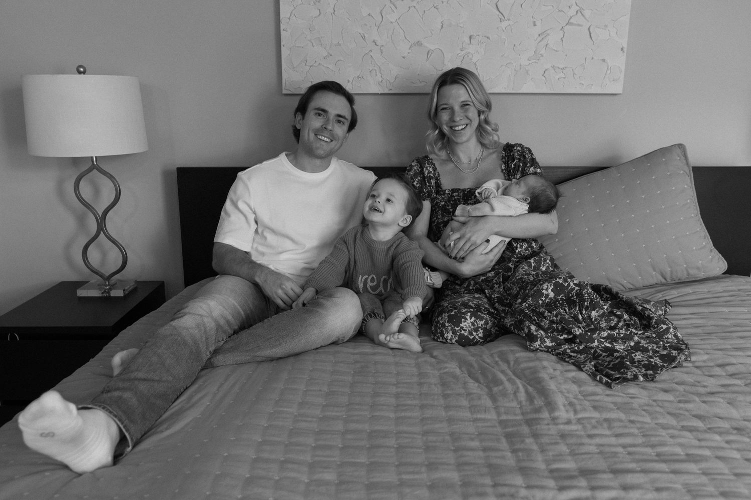 A sequence of black and white photos shows a couple lying in bed together, arranged in a filmstrip style layout.