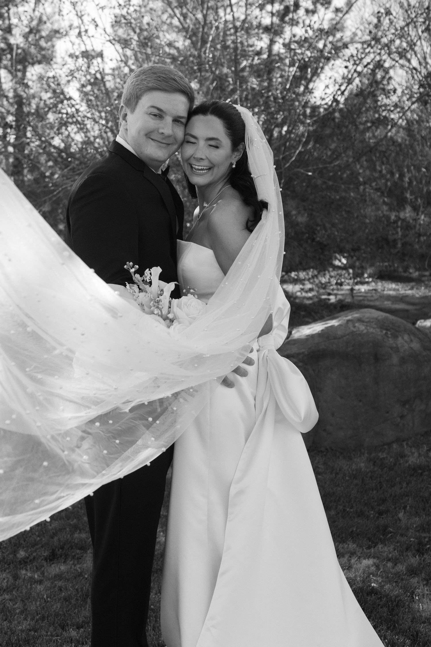 Artistic wedding photos showing a flowing veil caught in the breeze during an outdoor photoshoot.