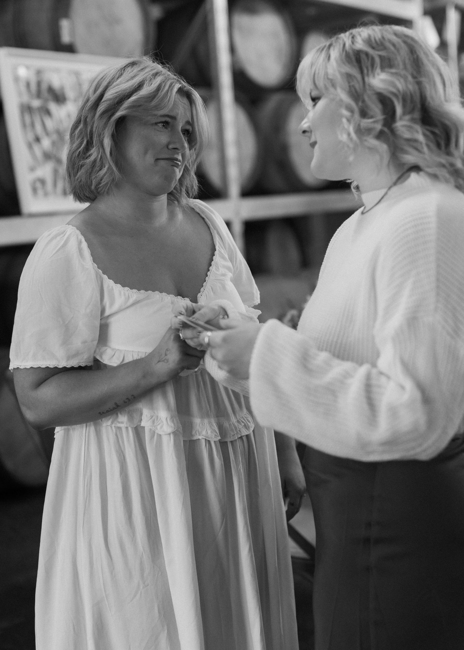 Black and white photos of dancers in flowing white dresses at a celebration.