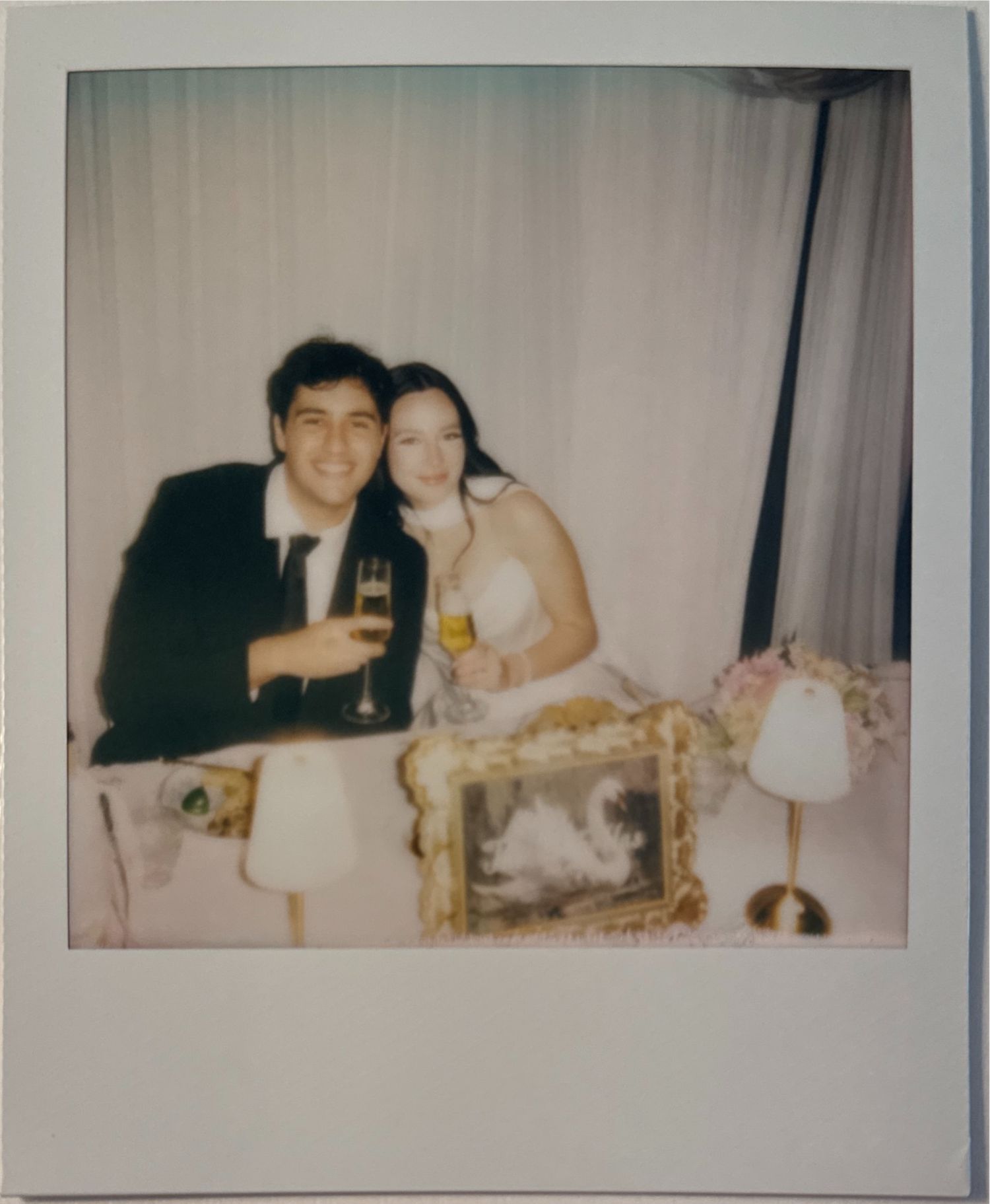 A series of vintage polaroid photos showing a couple sitting together at what appears to be a formal dinner or celebration.
