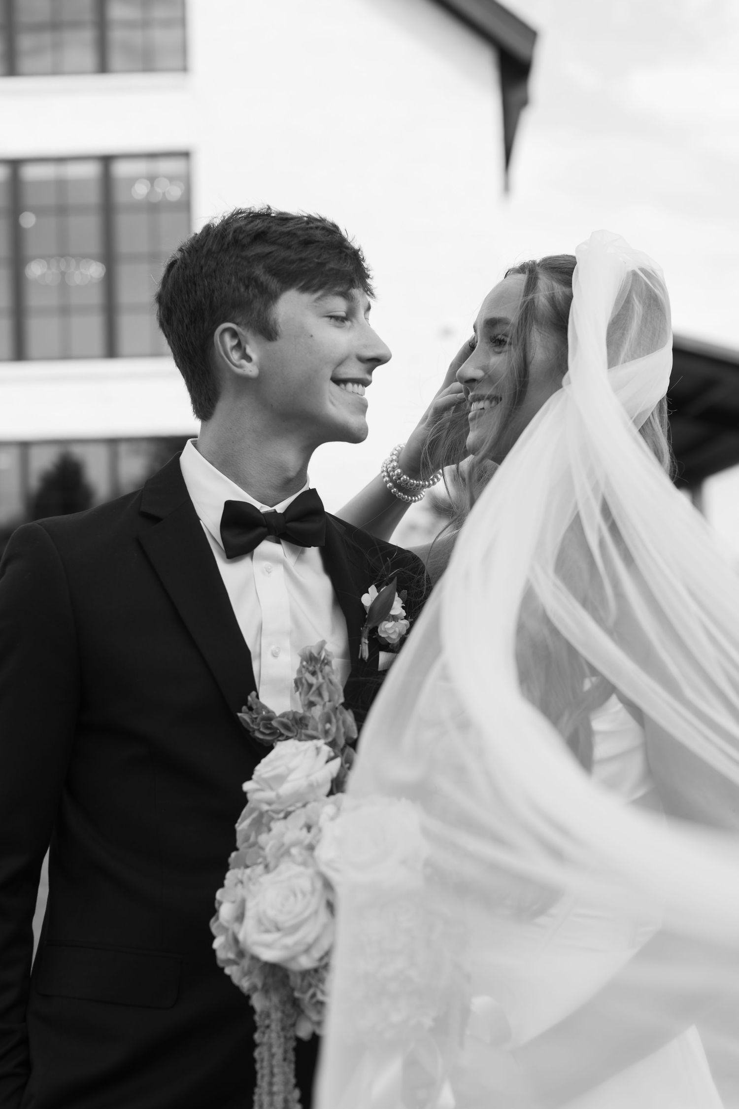 A joyful wedding couple share an intimate moment together, captured in three candid black and white photos.
