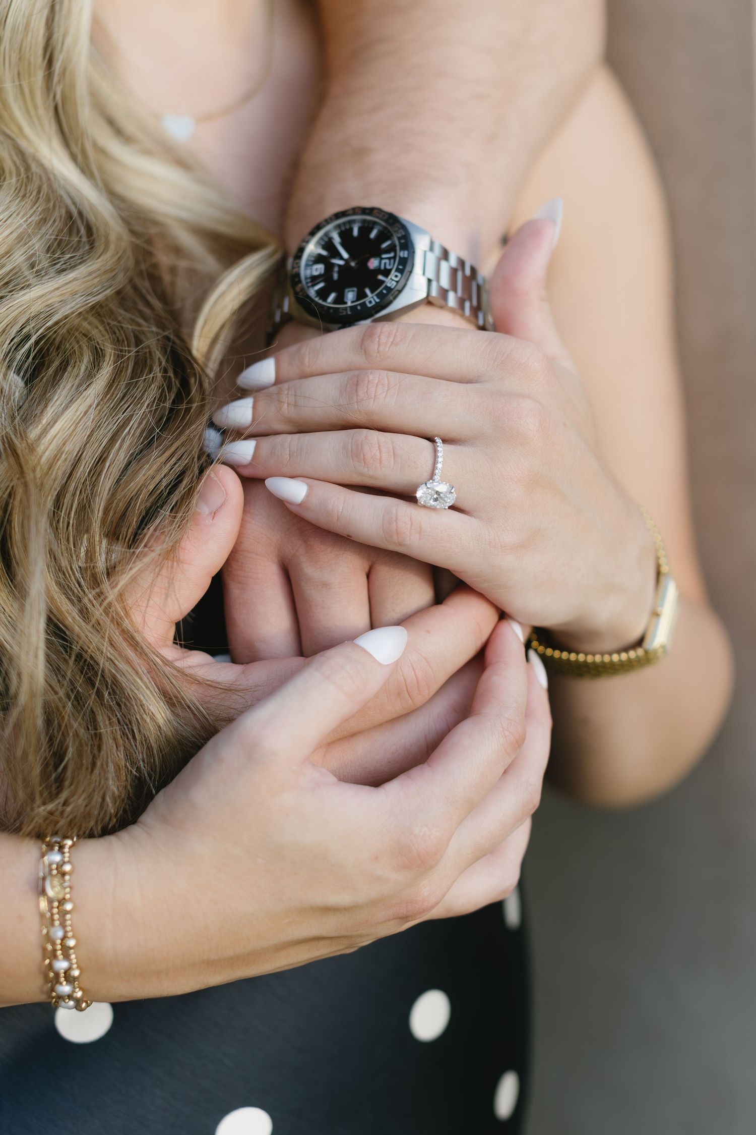 A sequence of close-up shots showing hands wearing an engagement ring, watch, and delicate bracelets against a blurred background.