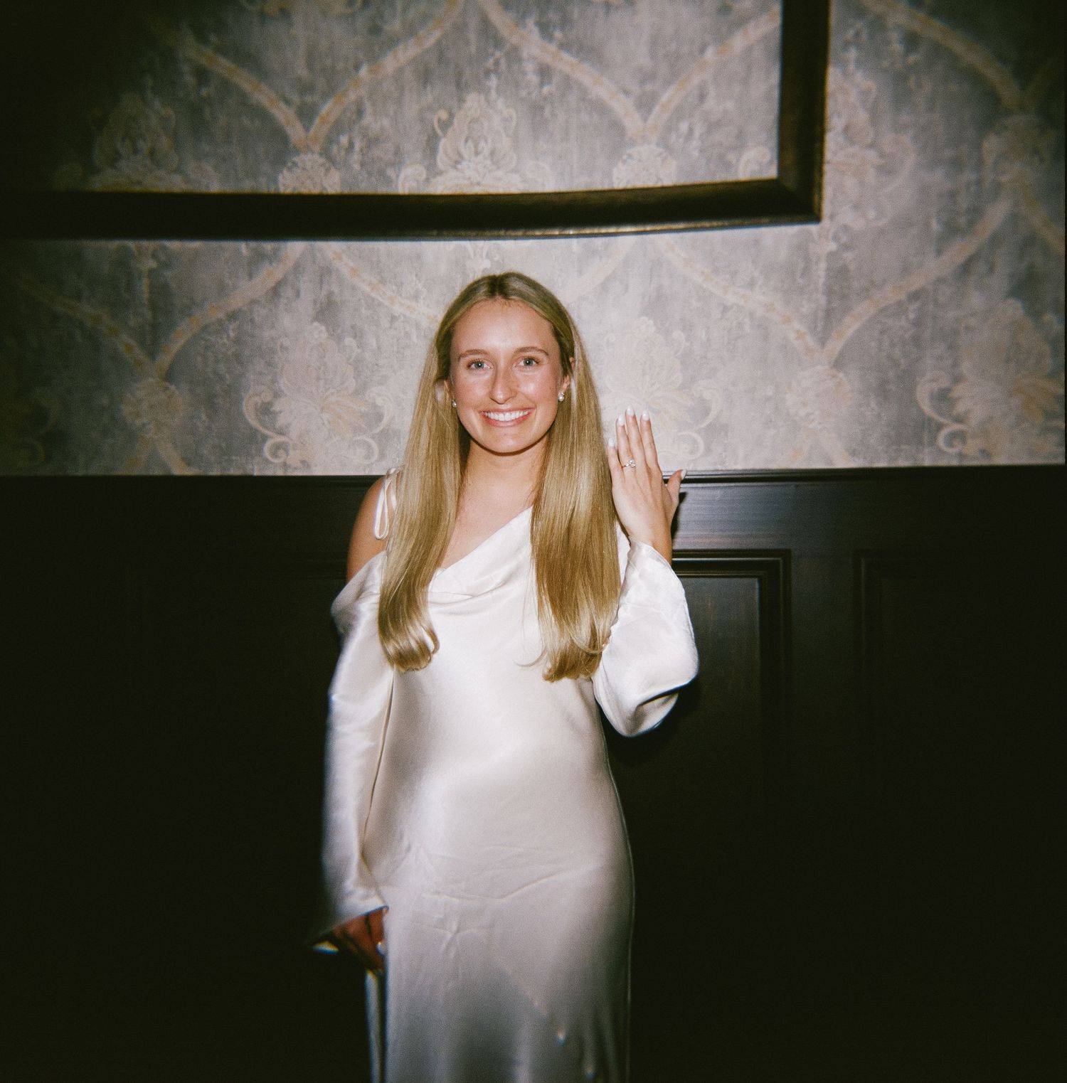 Artistic film-style photographs displayed against textured wall background.