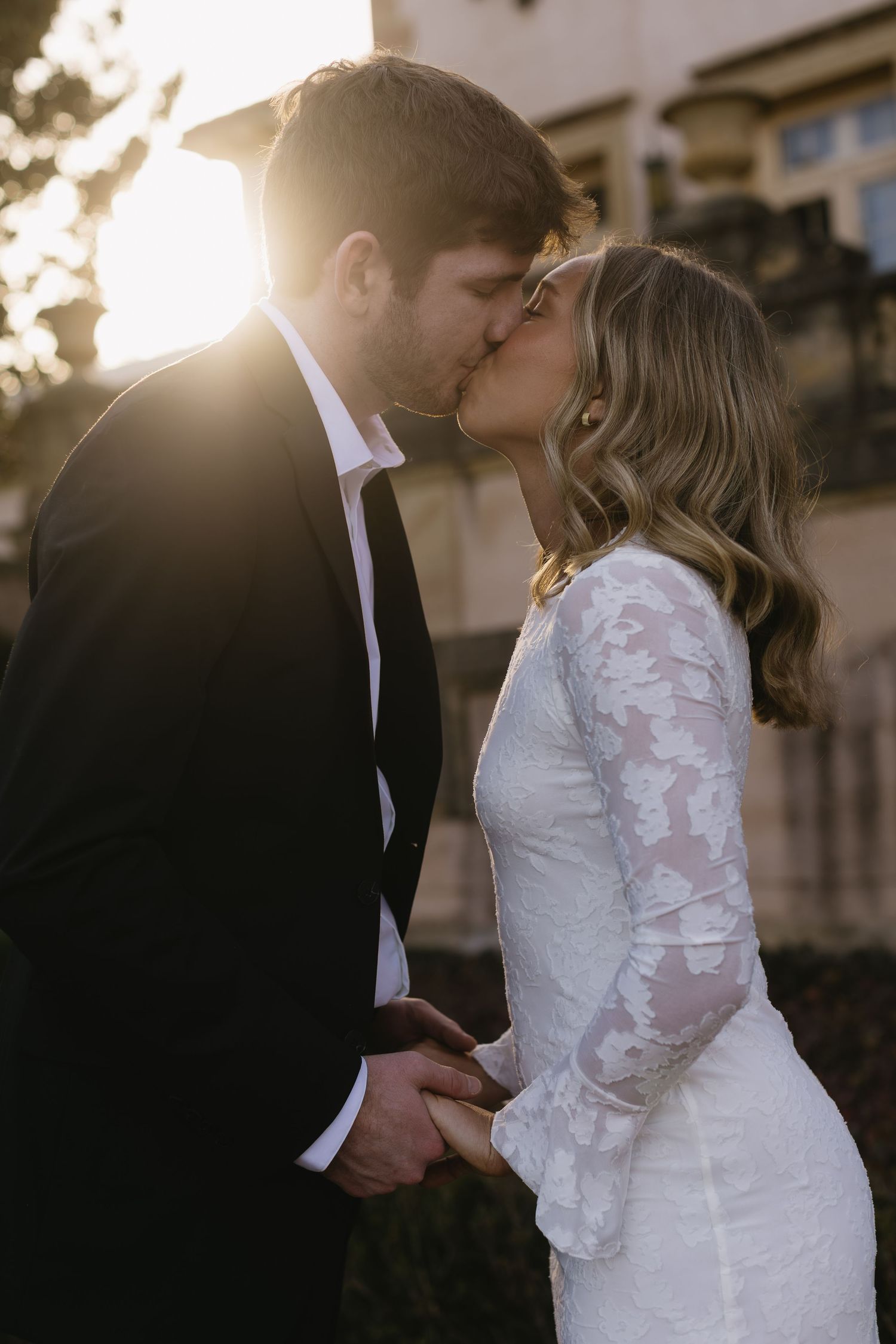 A romantic sunset wedding sequence showing tender moments between a couple in formal attire.