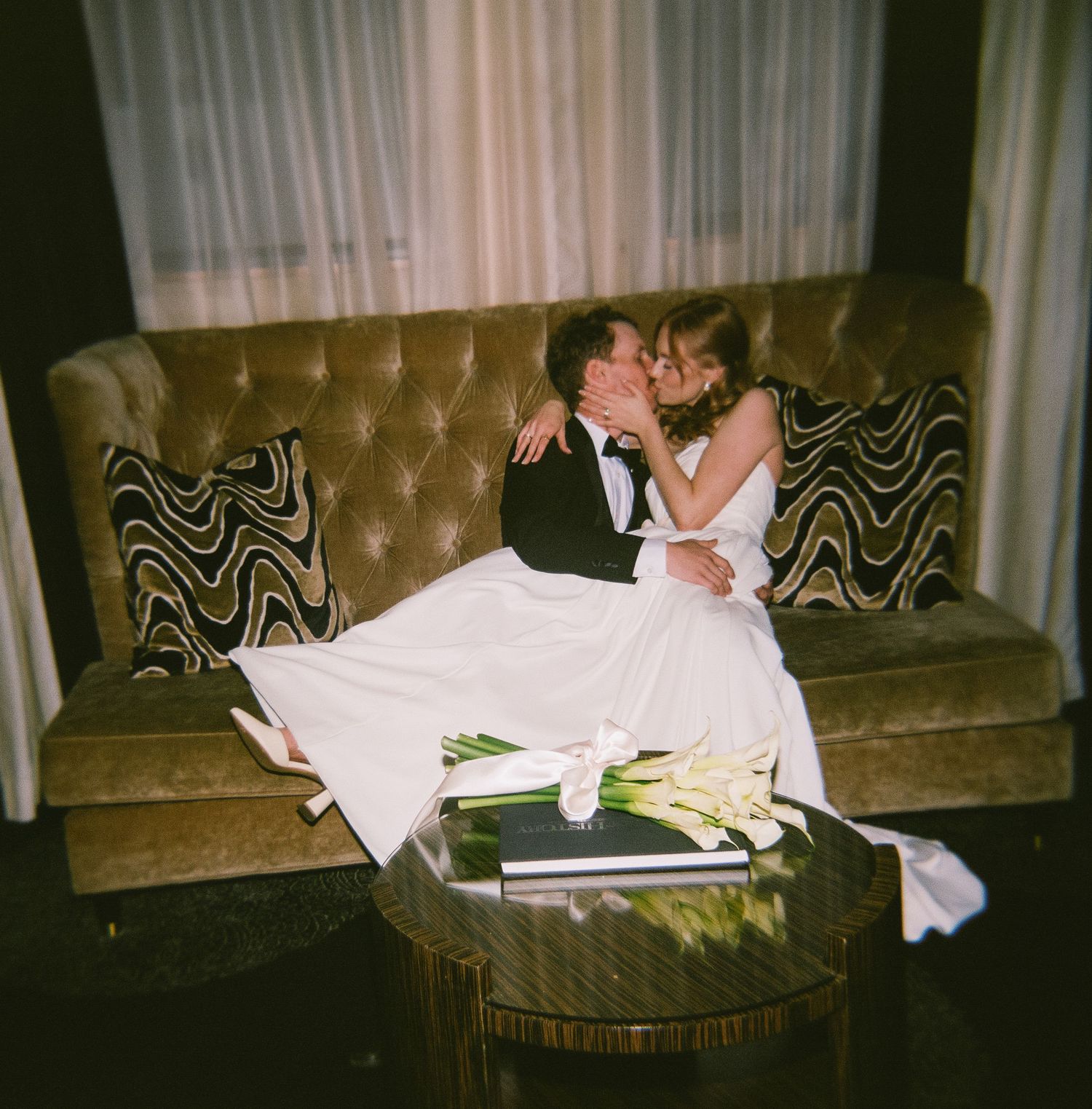 Vintage-style photos of guests relaxing on a brown velvet couch.