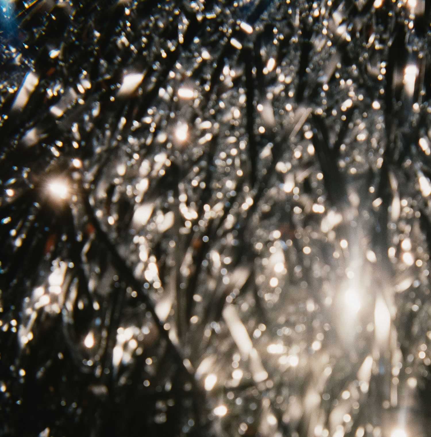 Sparkling crystal chandelier details creating a glamorous lighting effect.