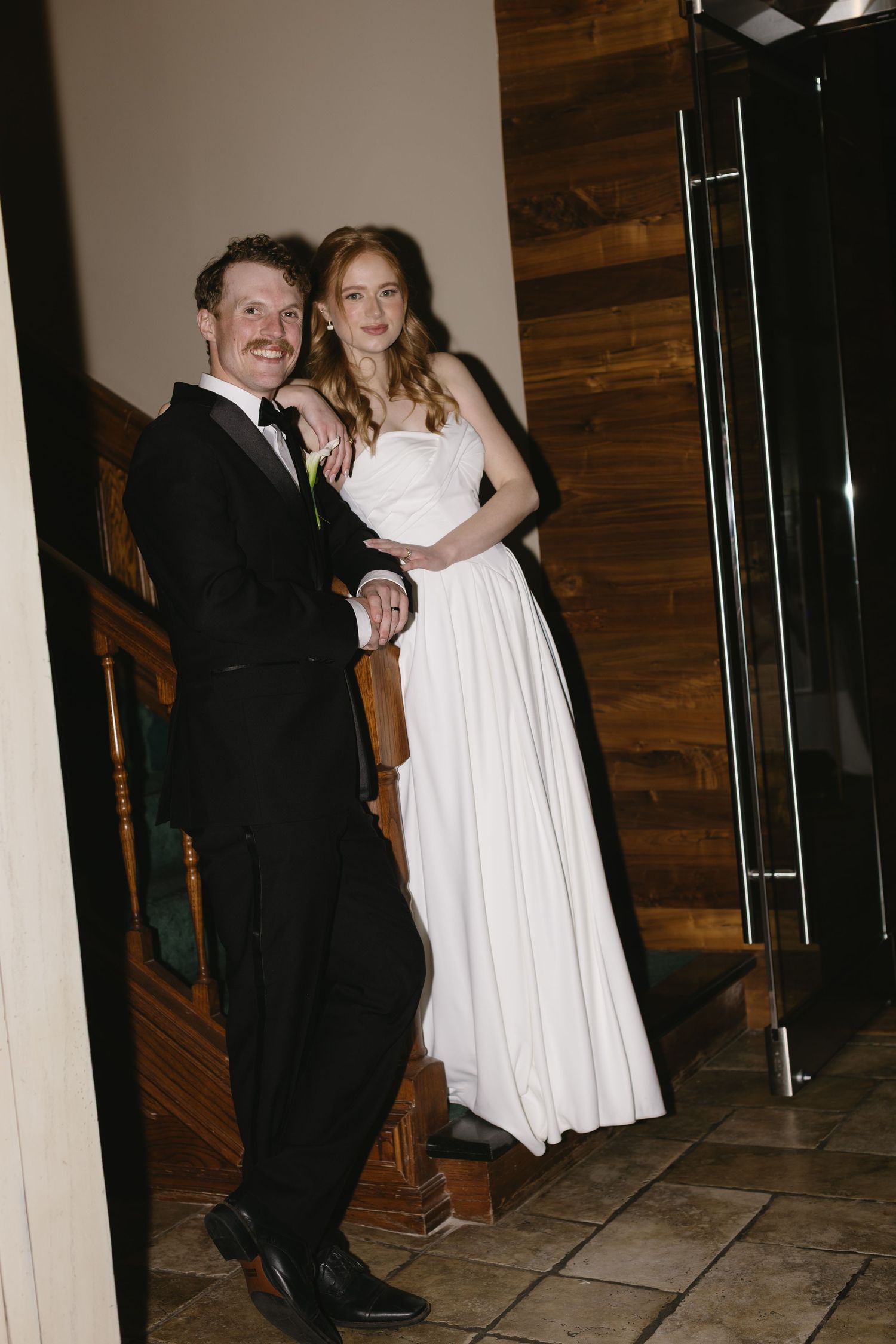 Wedding reception dance floor with couples dancing in formal attire.
