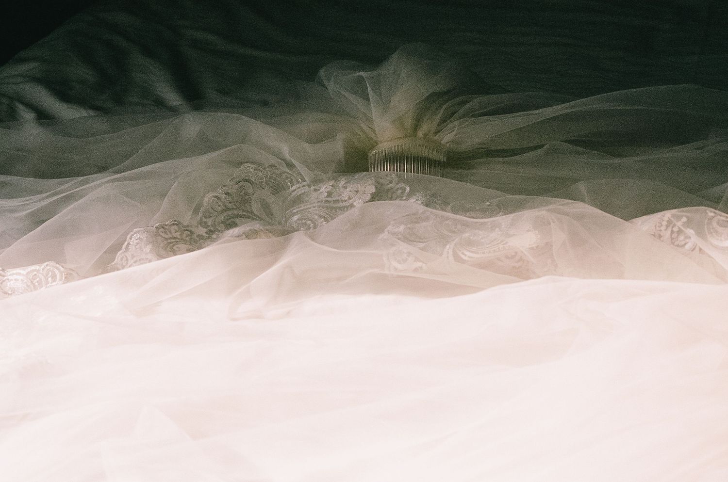 Layers of white tulle wedding dress fabric create an ethereal detail shot.
