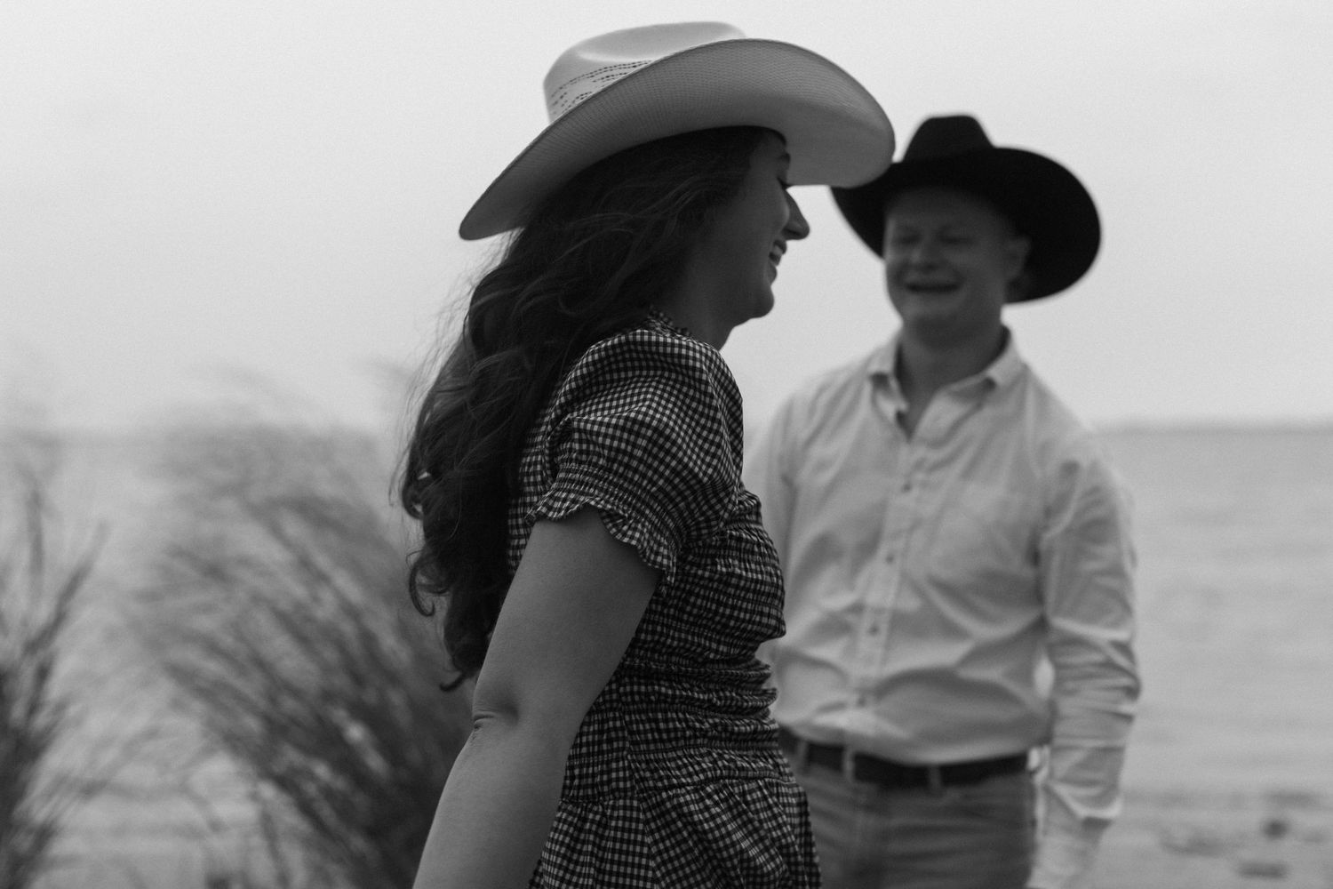 Series of intimate black and white portraits showing couple in cowboy hats.