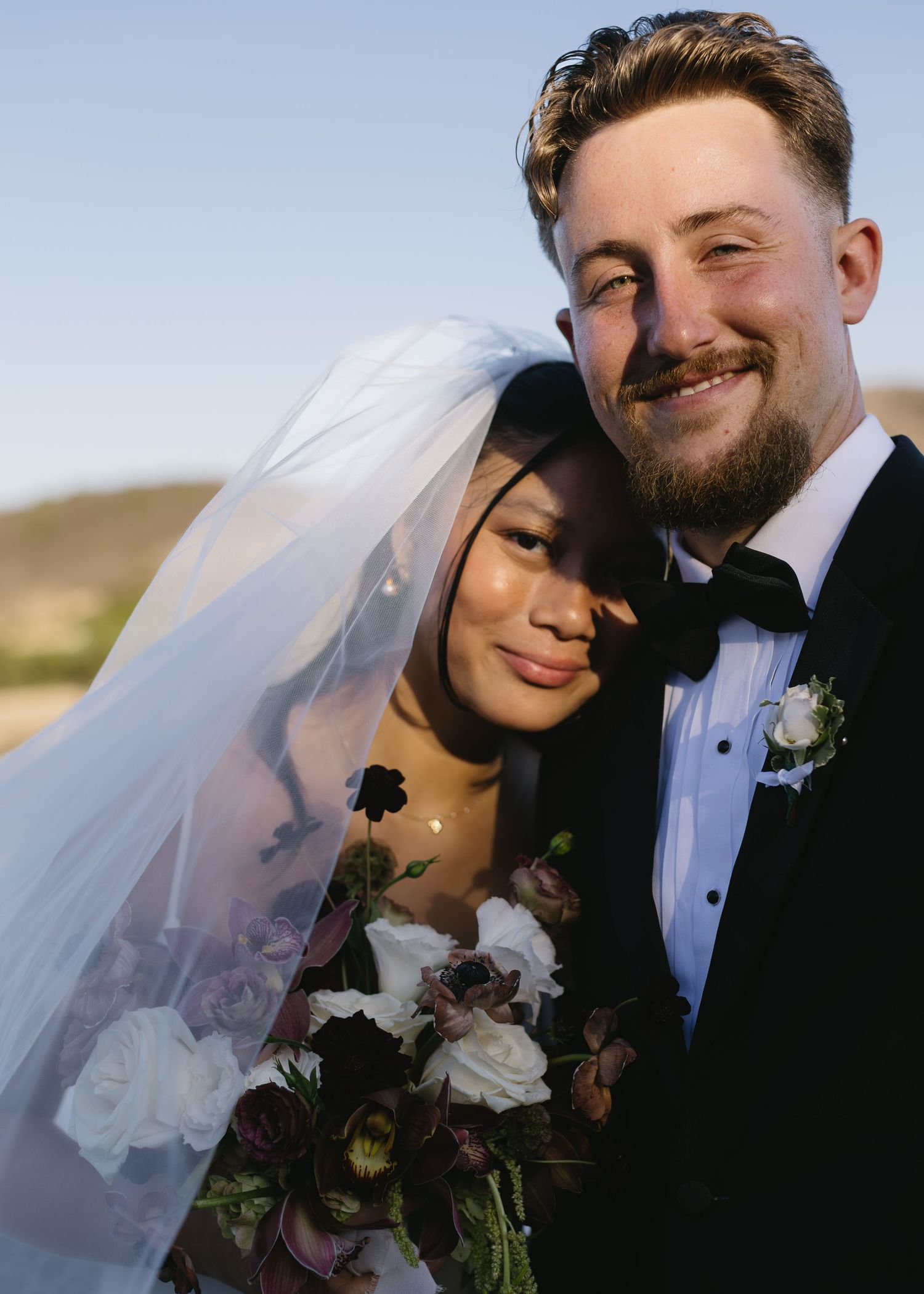 Intimate wedding portraits captured during golden hour showing tender moments between newlyweds.
