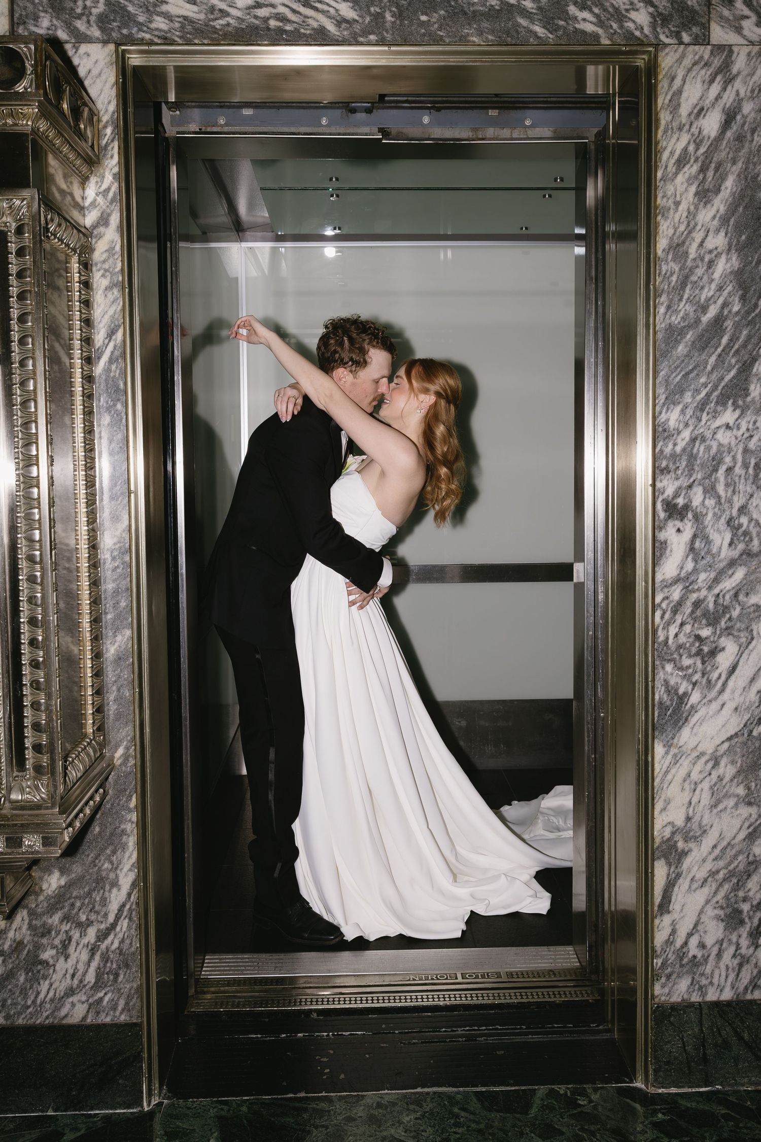 A series of artistic wedding photos showing a couple dancing in an elegant elevator with marble walls.