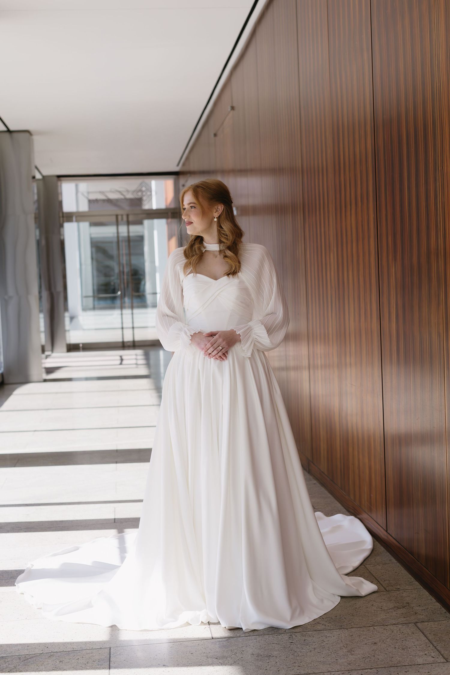 Series of bridal portraits showing a flowing white dress against wooden paneled walls.