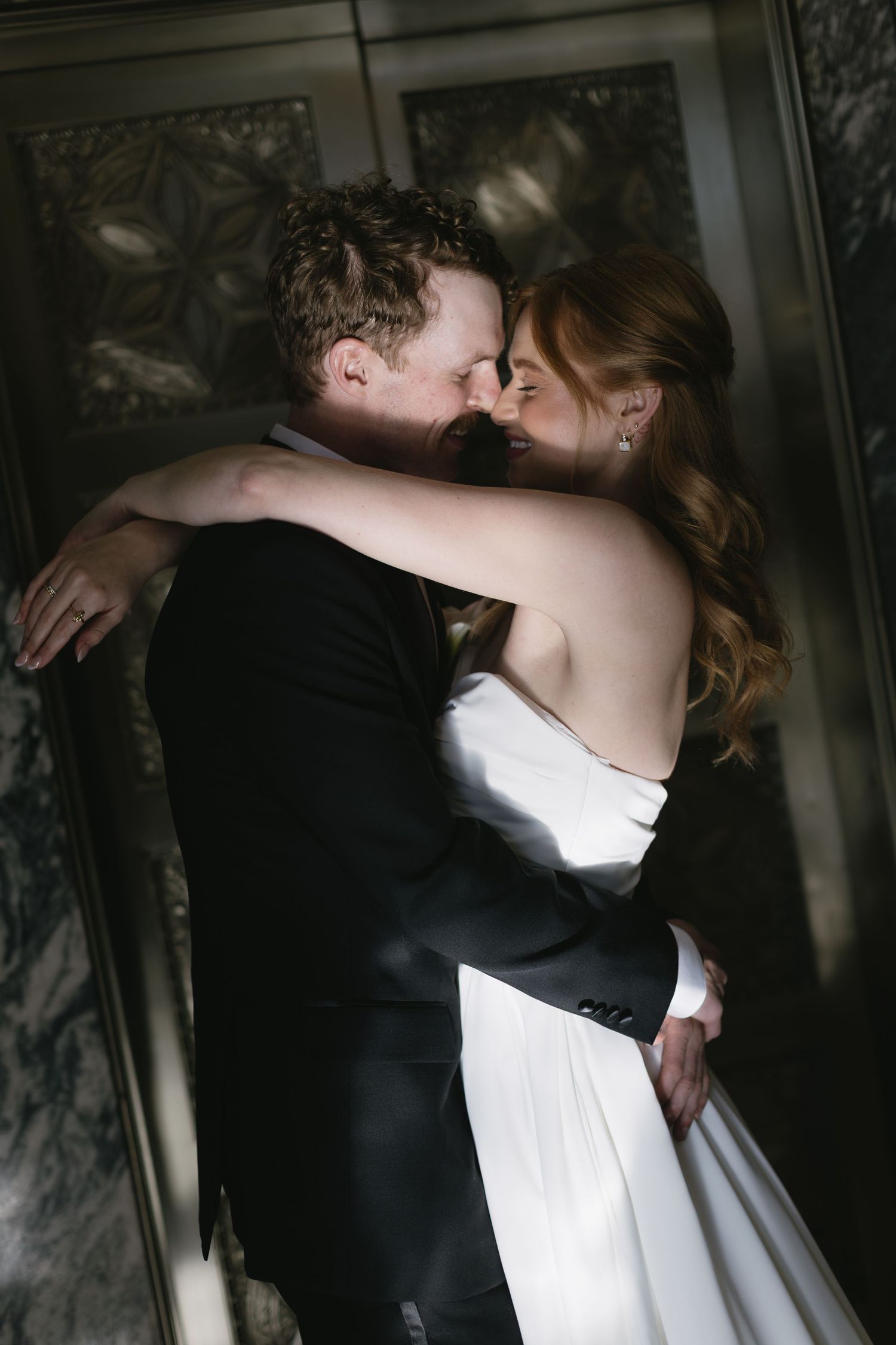 Intimate black and white wedding photos capturing romantic moments between newlyweds.