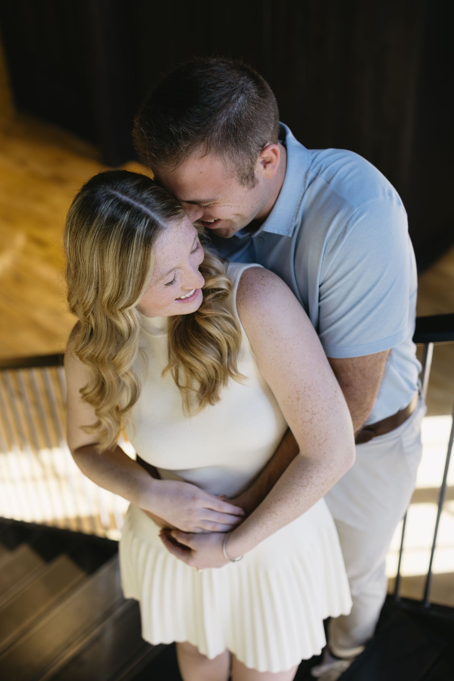 Intimate couple portraits with dramatic lighting showing tender moments between two people.
