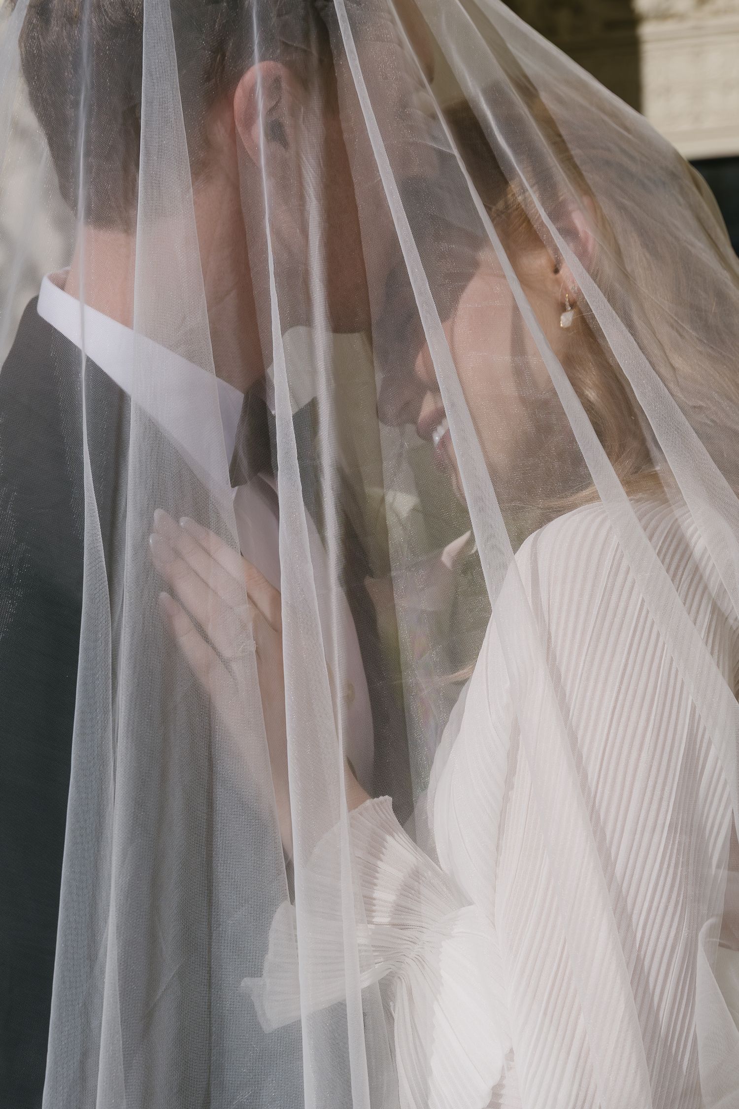 Close-up detail of delicate bridal veil with soft focus.