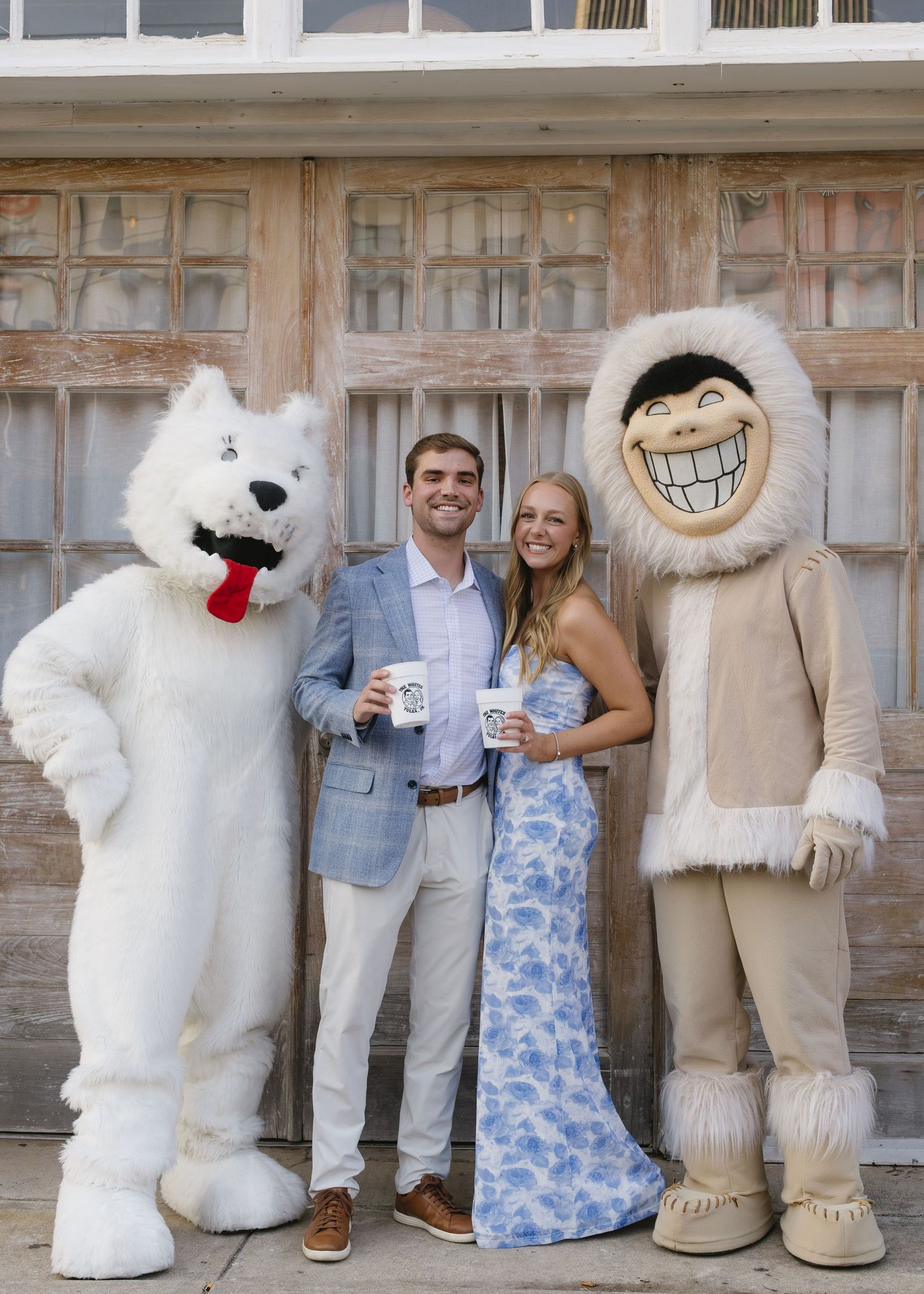 A collage showing three similar poses with a person and a large white polar bear mascot against a brick wall background.