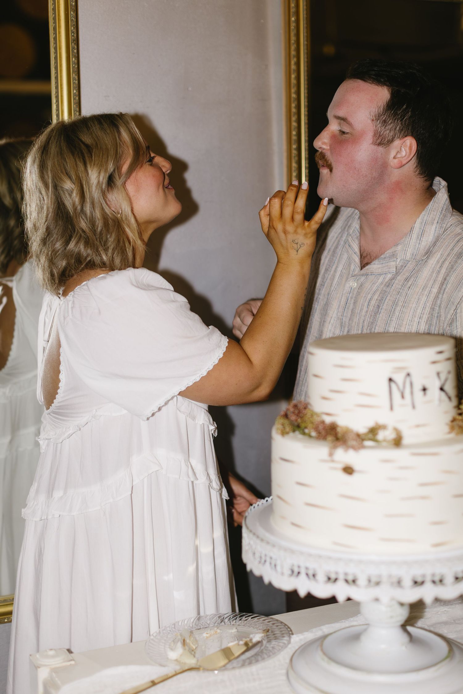 Wedding cake cutting moment captured in a sequence of photos.