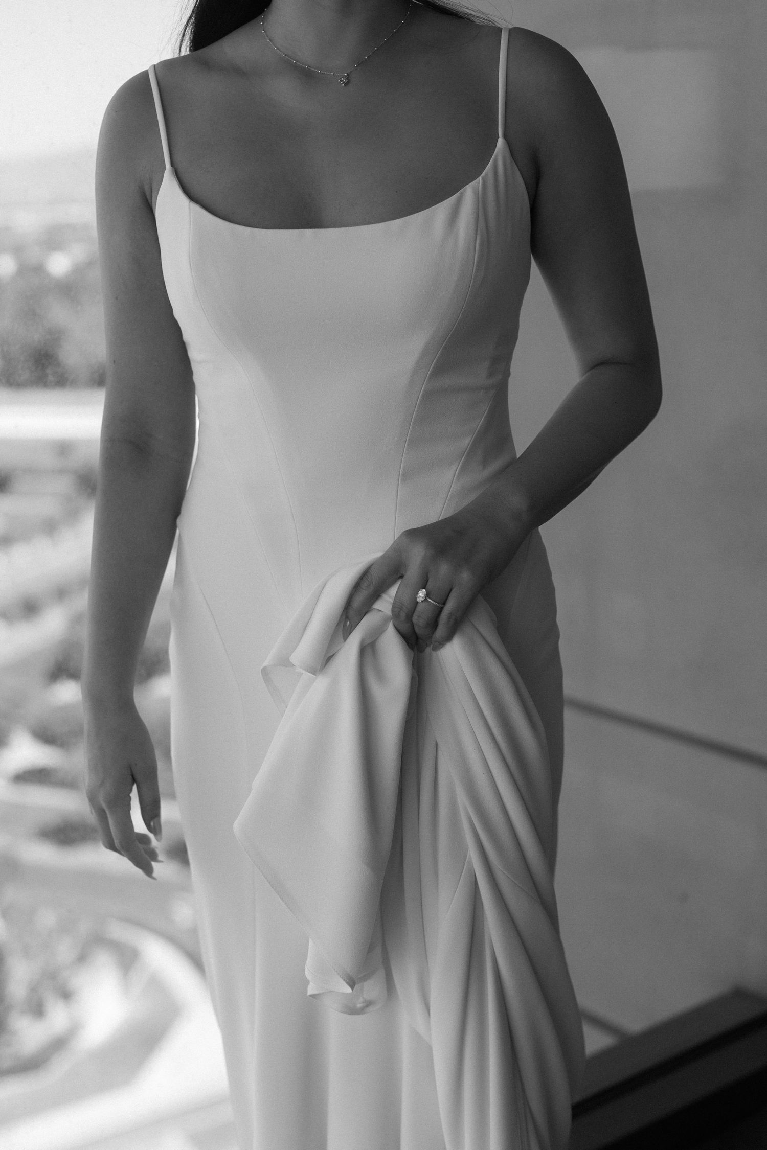 Close-up details of an elegant white wedding dress showing various angles and fabric draping.