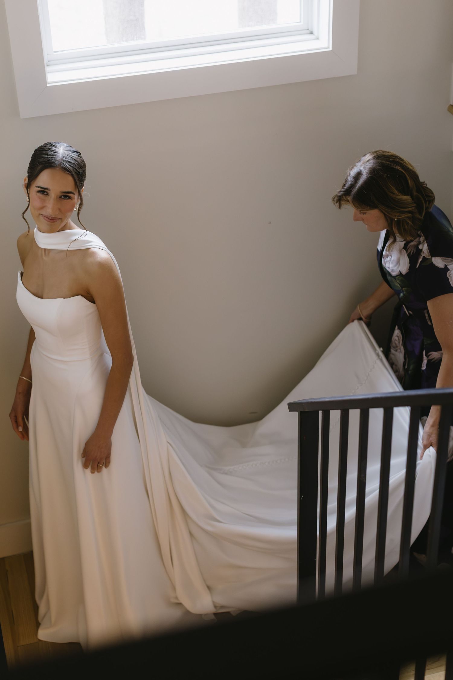 Series of photos showing a white wedding dress being adjusted in a sunlit room.