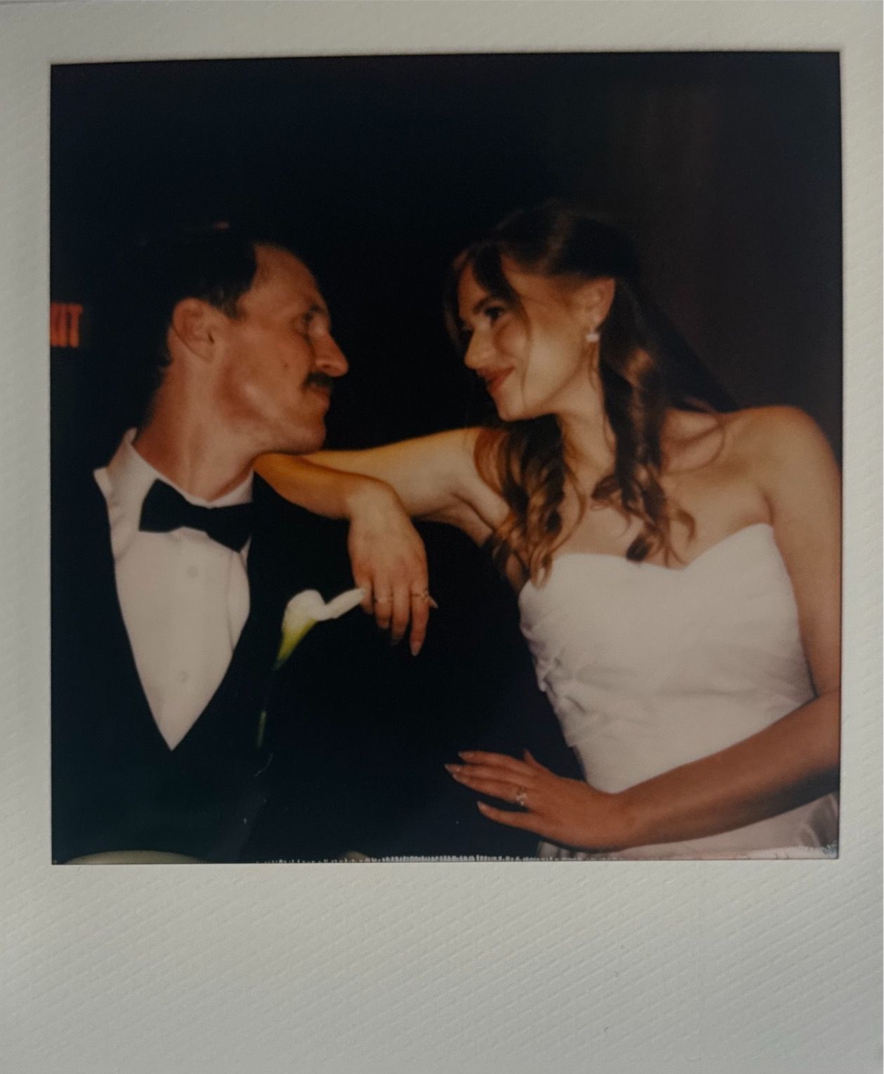 Series of intimate polaroid-style wedding photos capturing candid moments.