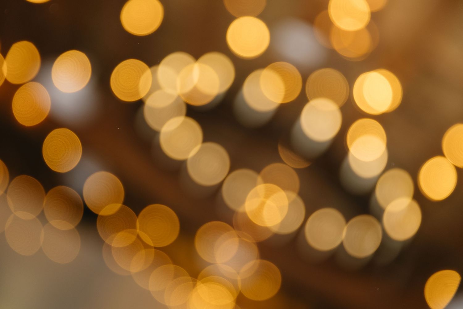 Warm golden bokeh lights creating romantic background effect.