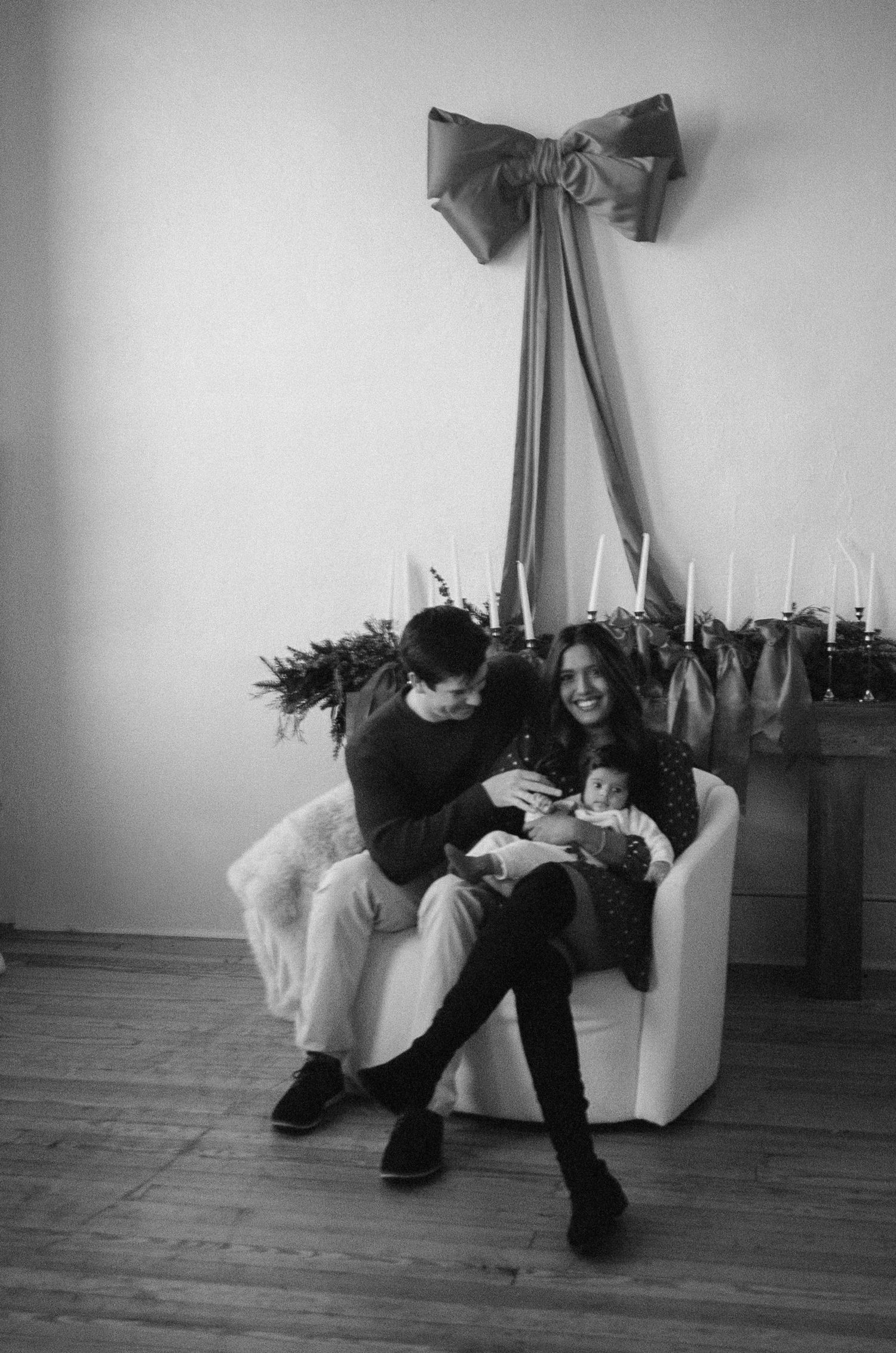 A black and white photo sequence showing people relaxing on comfortable chairs in a room with wooden floors.
