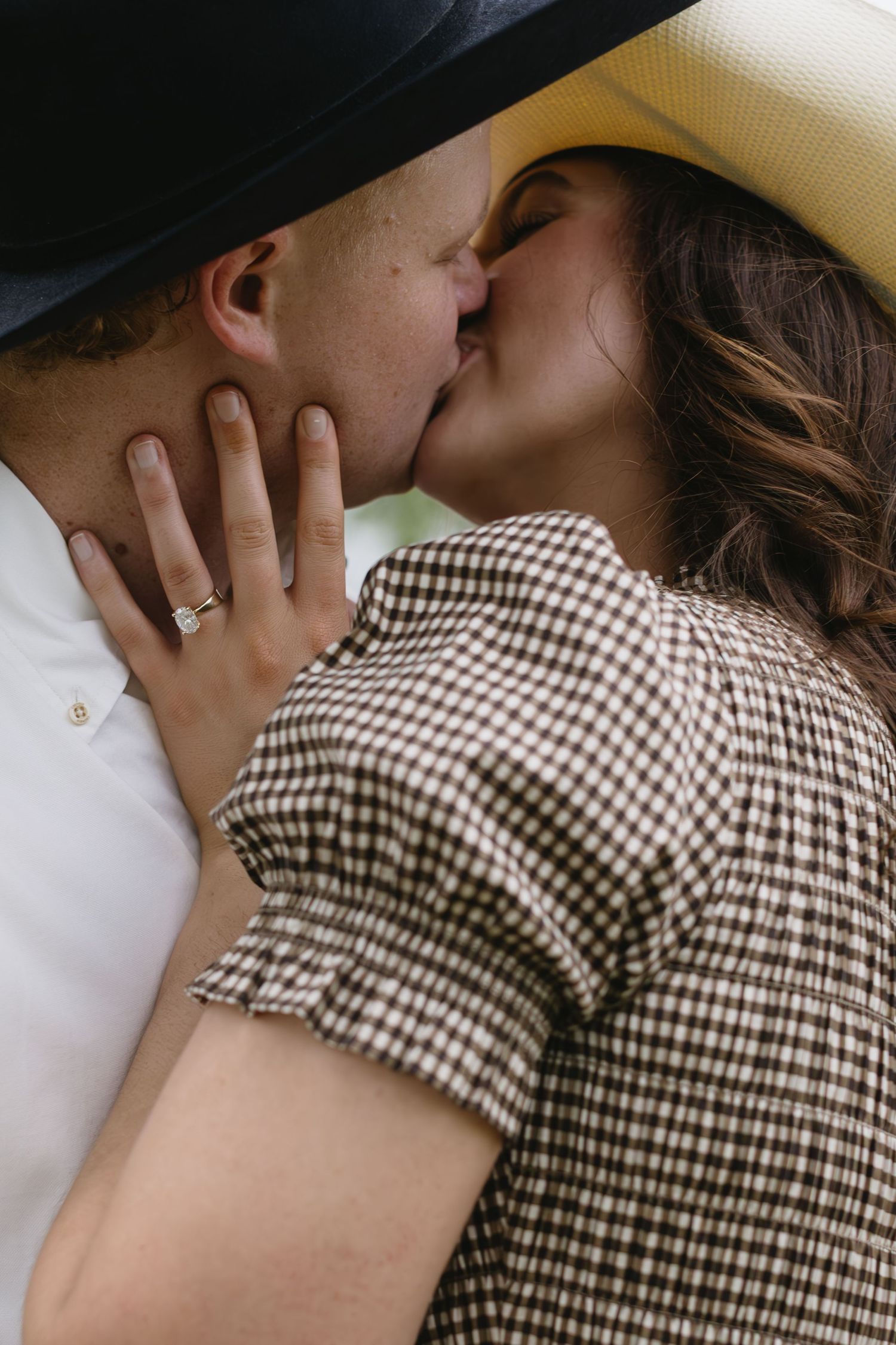 Close-up shots of an intimate moment between a couple wearing checkered clothing.