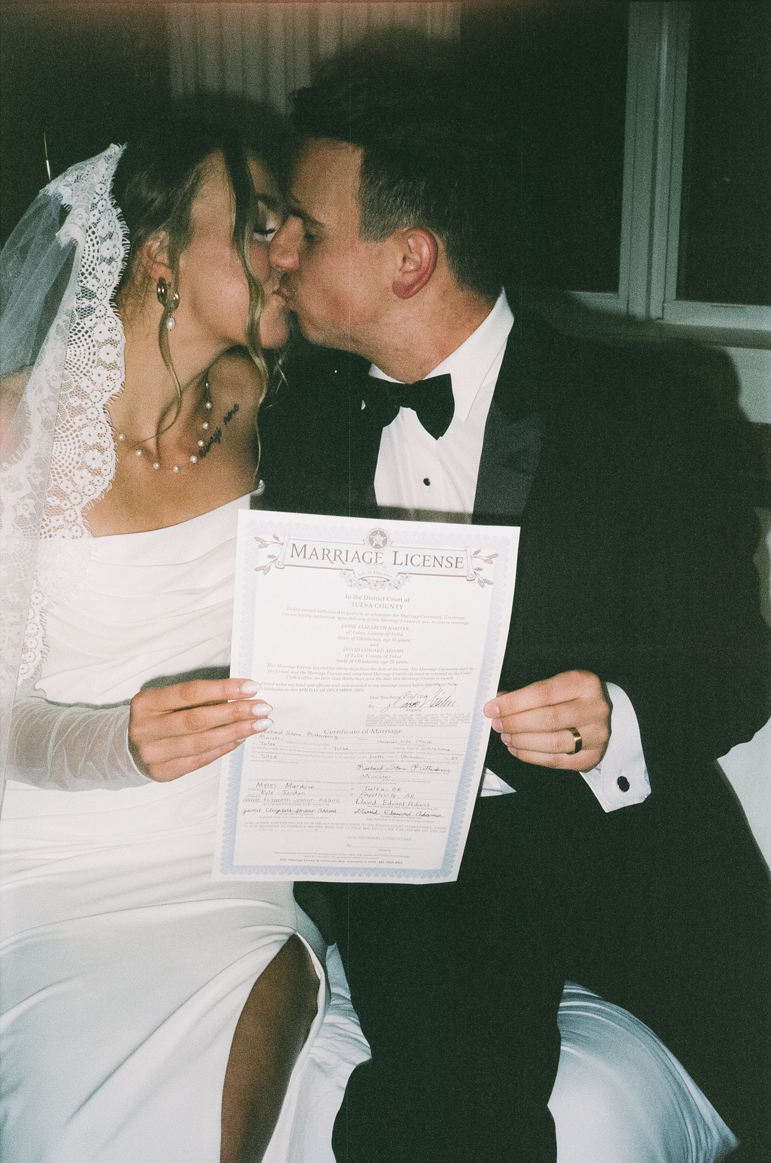 A couple in wedding attire share a kiss while holding their marriage license in a series of connected photos.