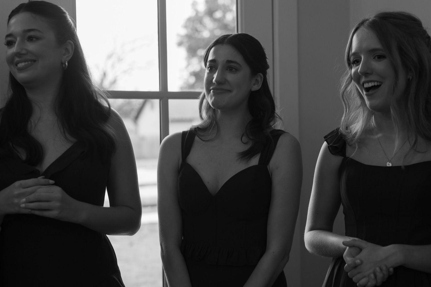Candid moments of people in dark formal attire gathered indoors.