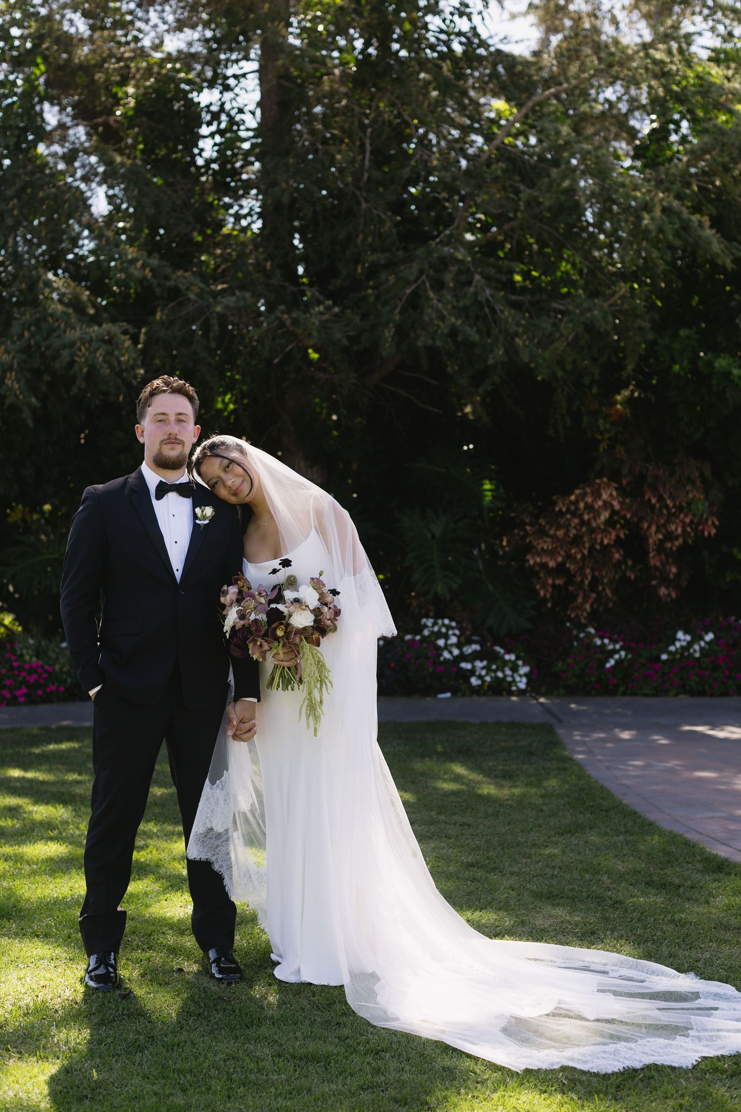 A romantic wedding photo sequence showing a couple in formal attire embracing on a sunny lawn with trees in background.