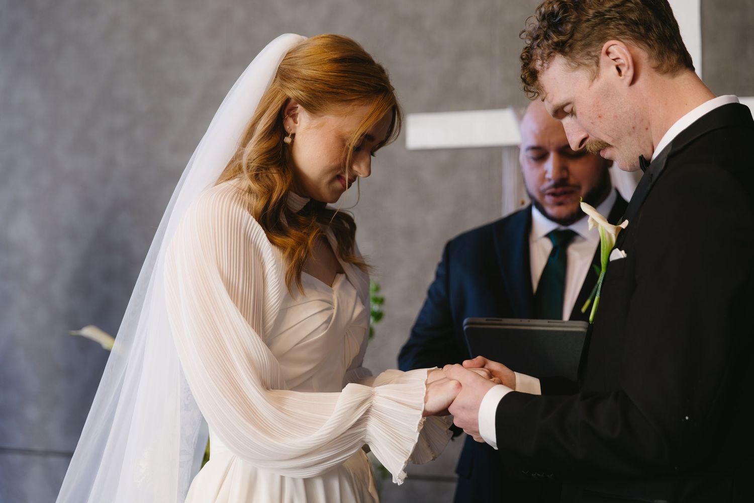 Intimate wedding ceremony moments in an elegant indoor setting.