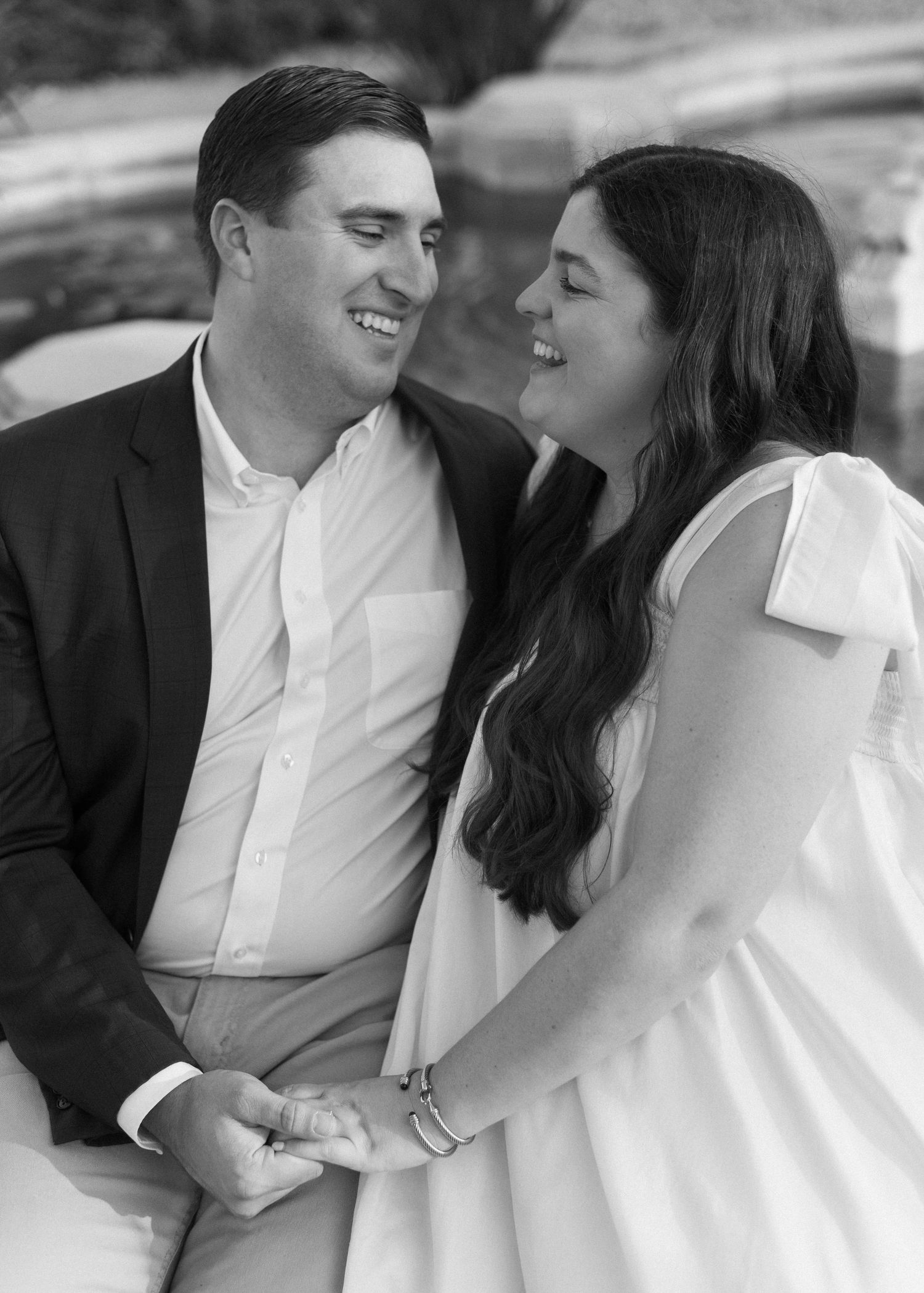A black and white series of intimate moments between a couple in formal attire.