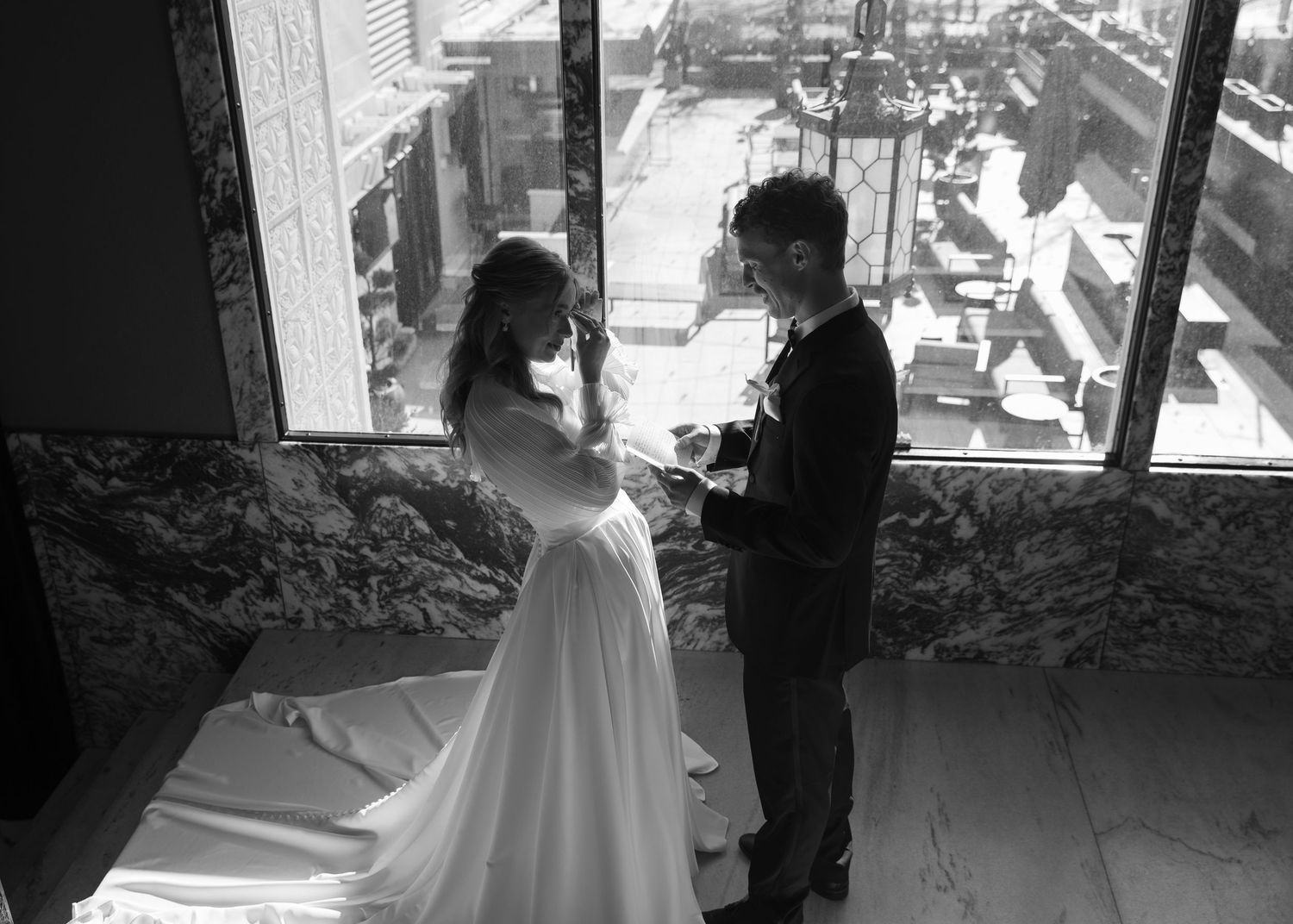 Black and white wedding first look photos capturing emotional reactions.