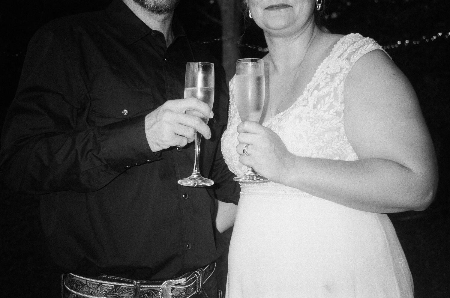 A series of black and white wedding reception photos showing guests holding champagne glasses and celebrating.