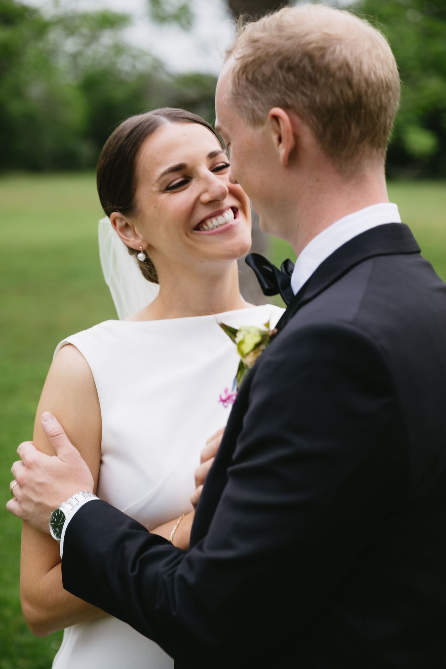 A series of joyful wedding photos showing a couple embracing outdoors in a lush green garden setting.