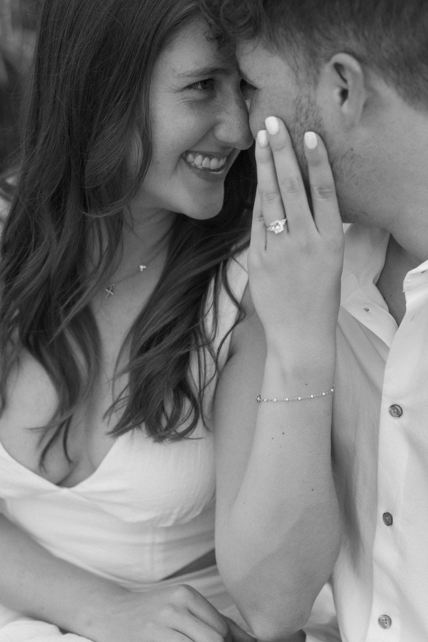 Intimate black and white close-up shots of a couple sharing tender moments together.