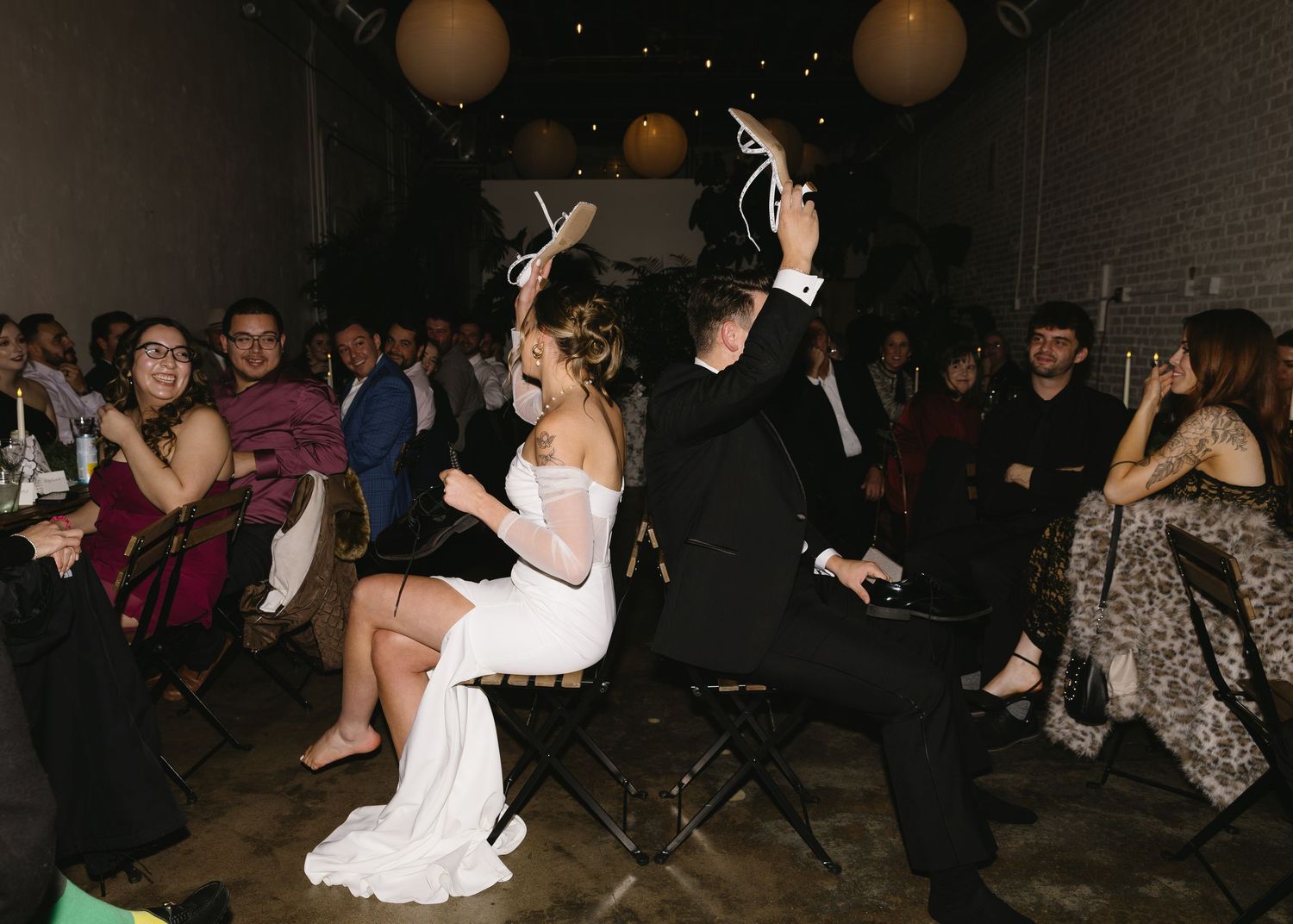 Wedding reception dance party with guests celebrating on the dance floor.
