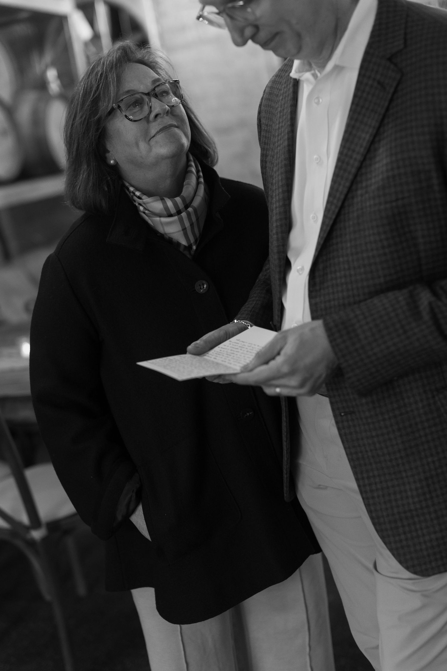 Two people in formal attire share an intimate moment at an event.