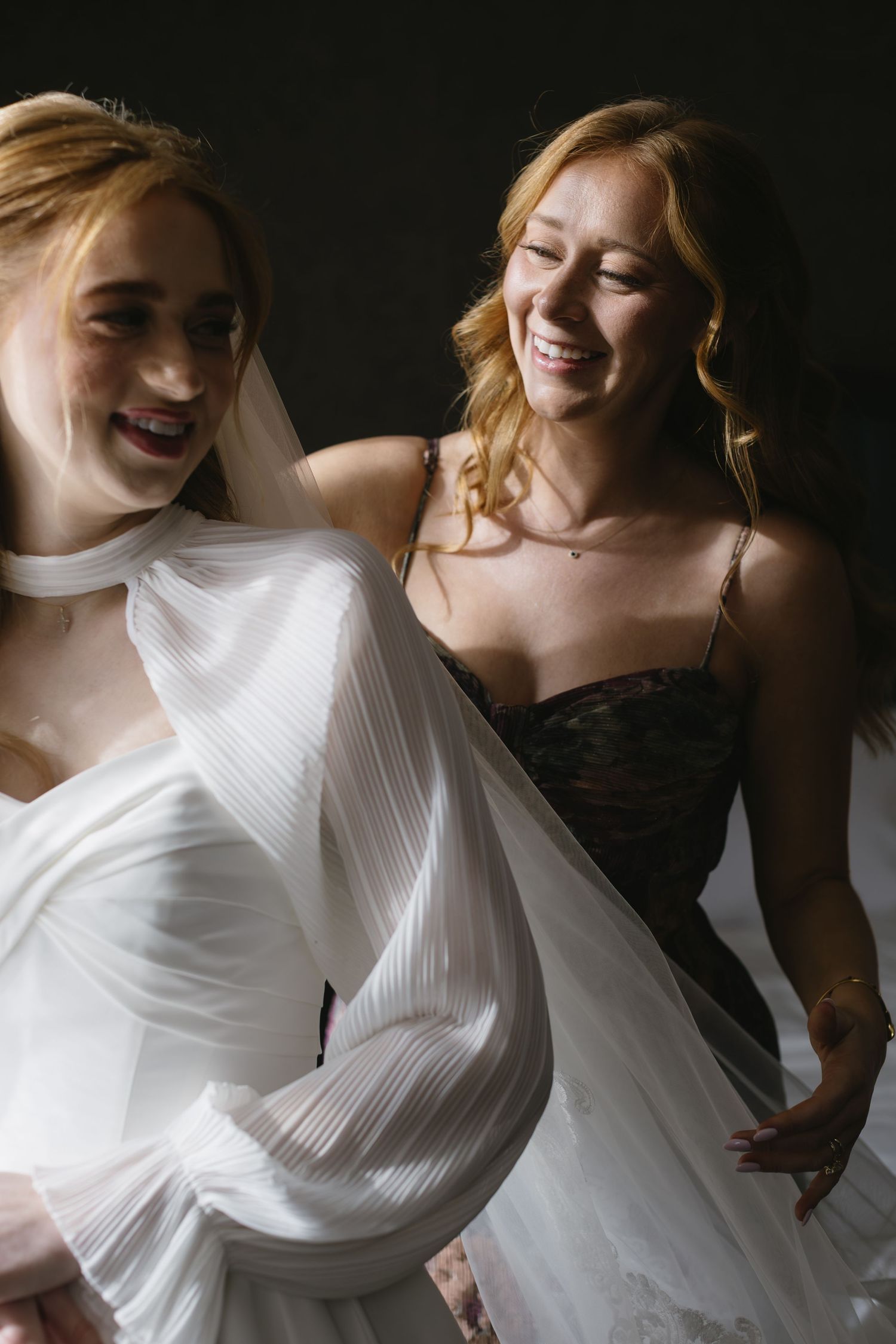 Dynamic shots of white wedding dress movement against dark background.