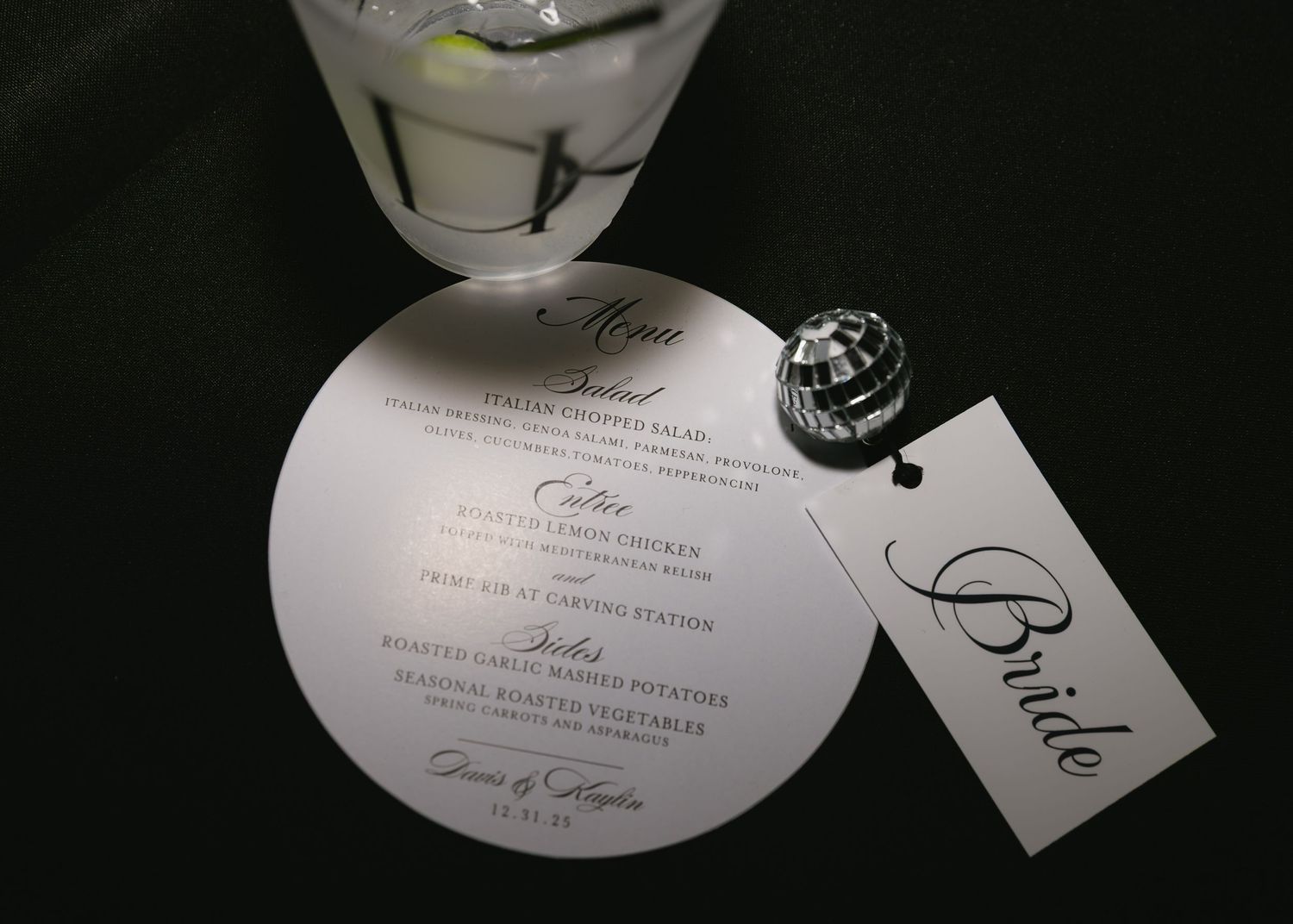Wedding reception menu cards with elegant calligraphy and decorative tags.