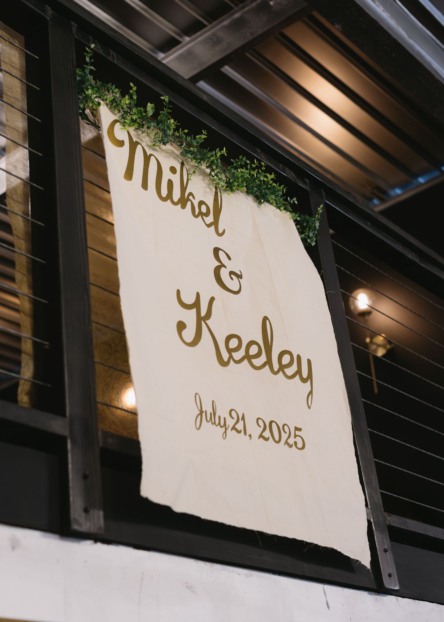 Elegant wedding signage with gold lettering and date May 21, 2035 displayed on a white background.