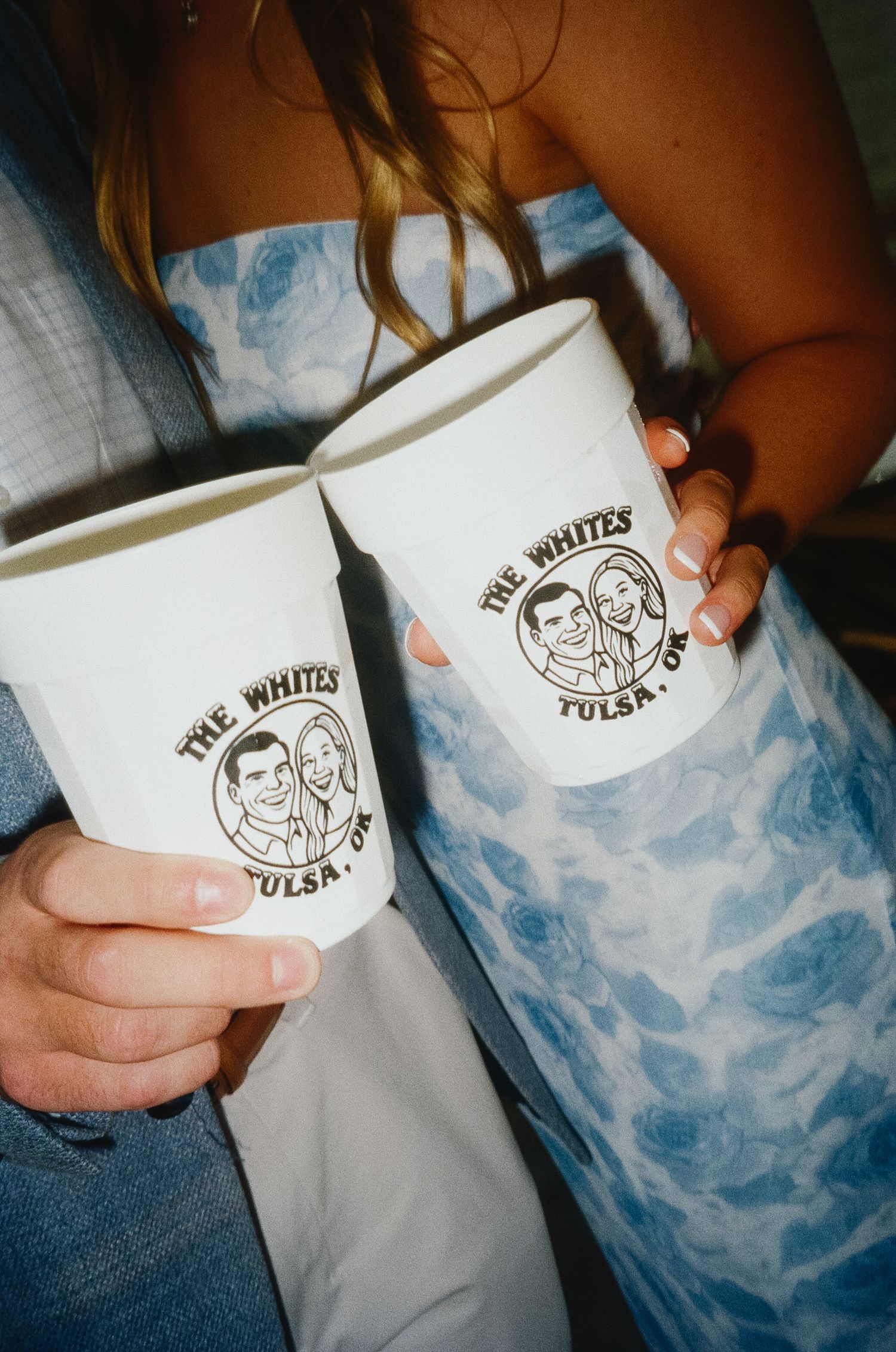 White ceramic coffee mugs with a custom logo design shown in a series of detail shots.