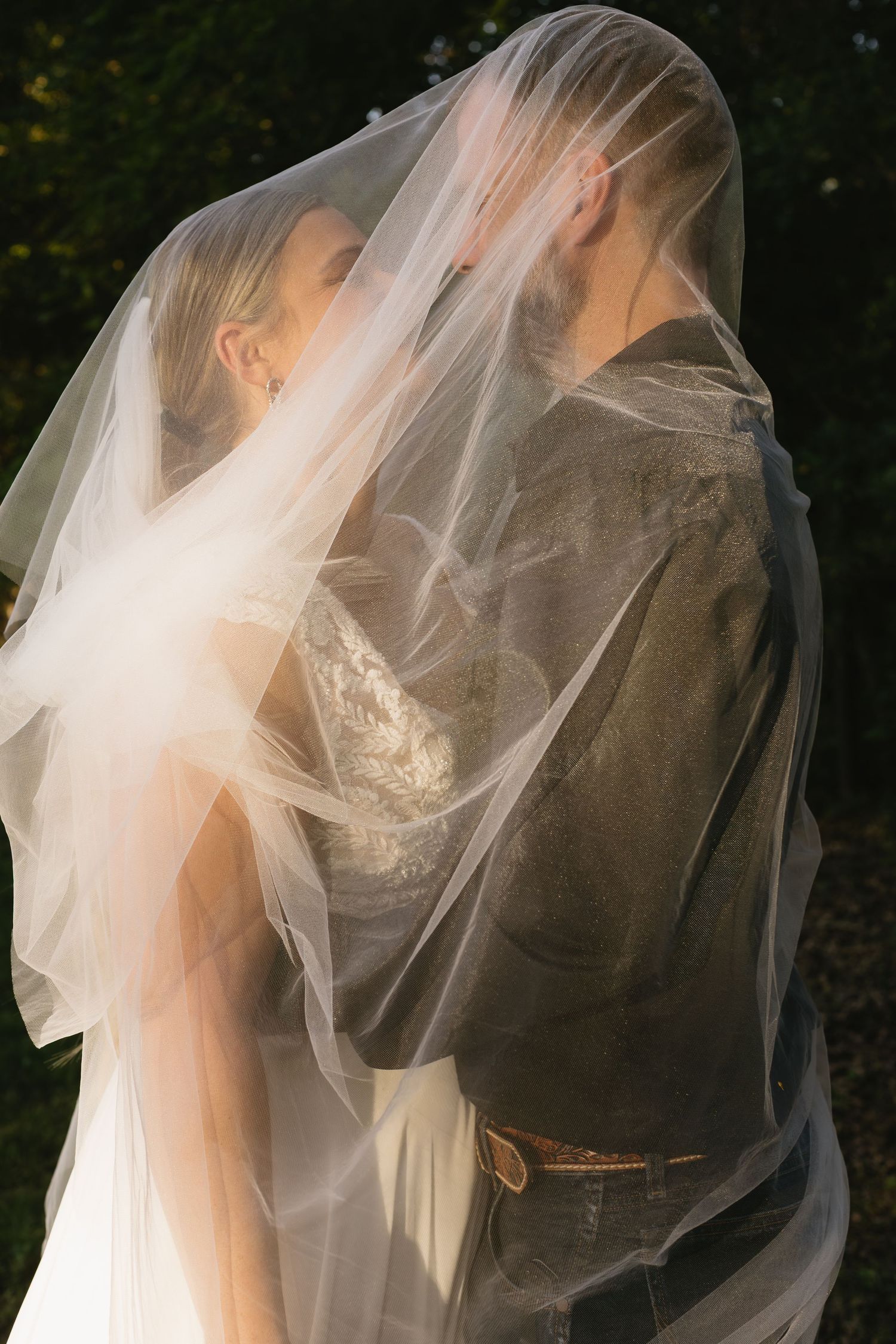 Romantic veil shots with sunlight filtering through sheer fabric.