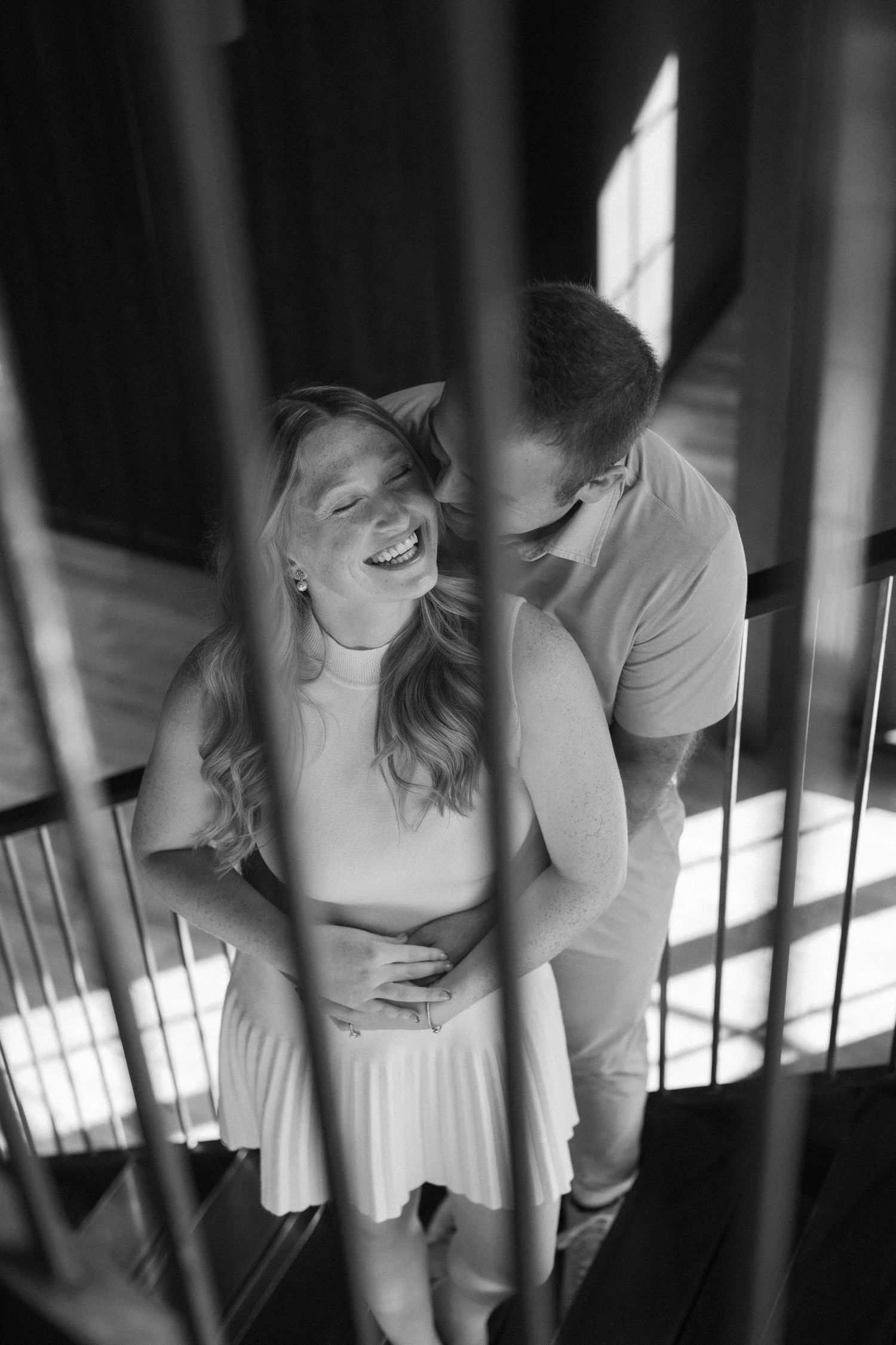 Black and white images of a couple sharing intimate dance moments with shadows cast from window light.