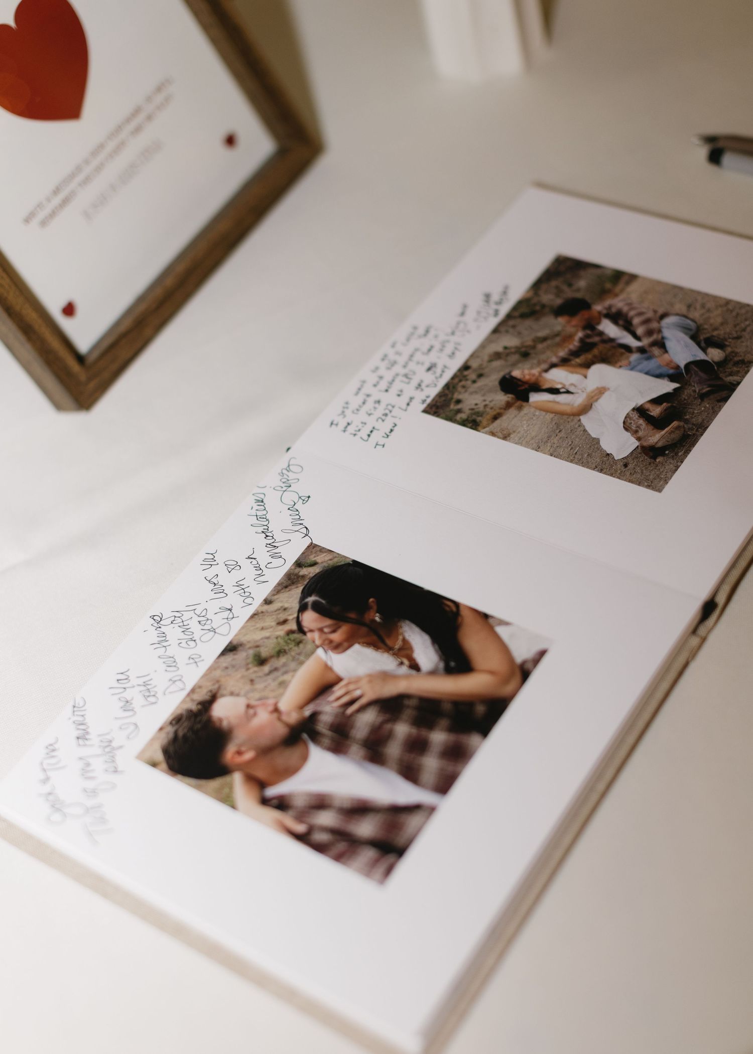 Wedding guestbook with handwritten messages and photographs.