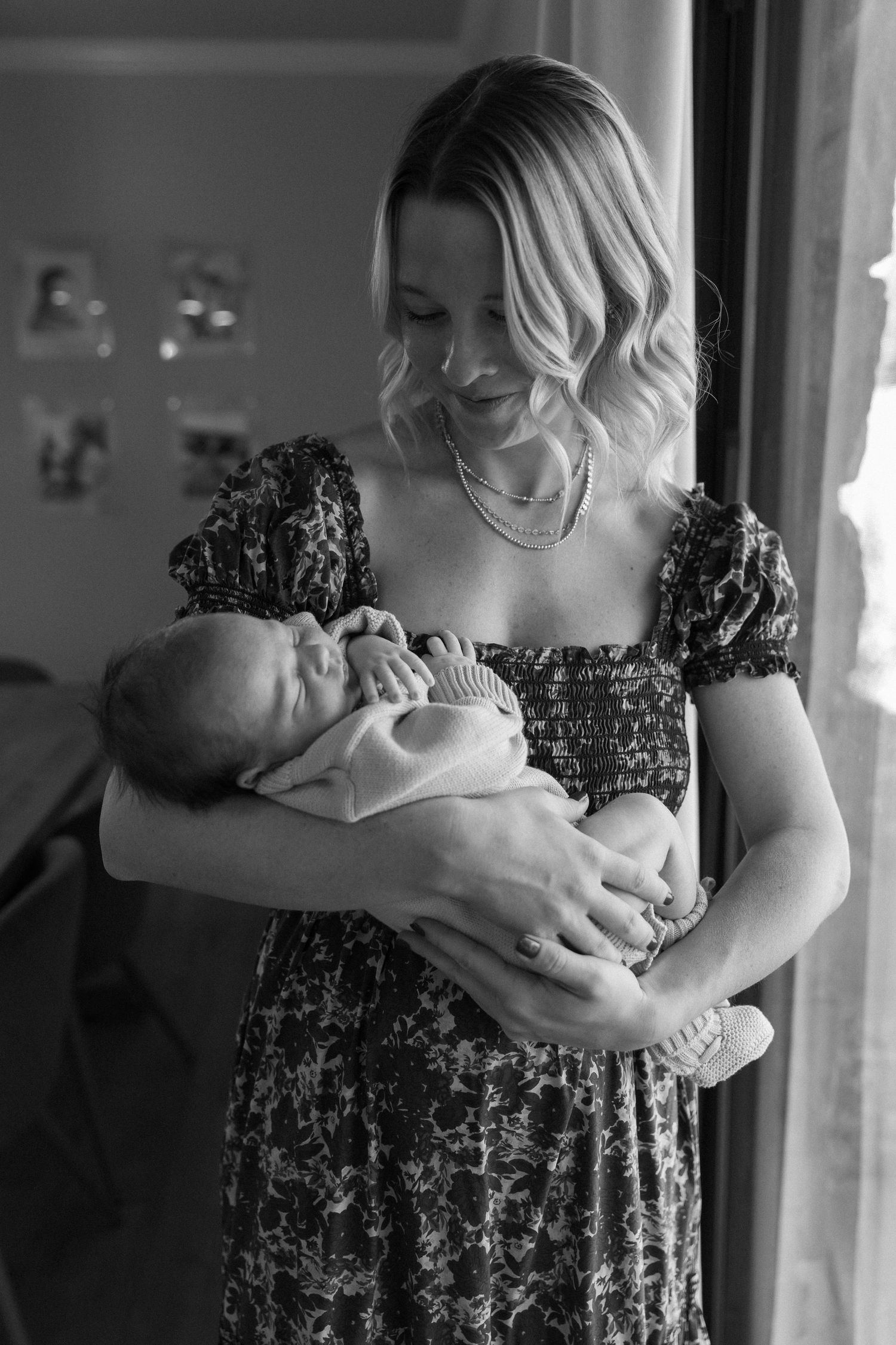 Black and white series showing tender family moments in natural light.